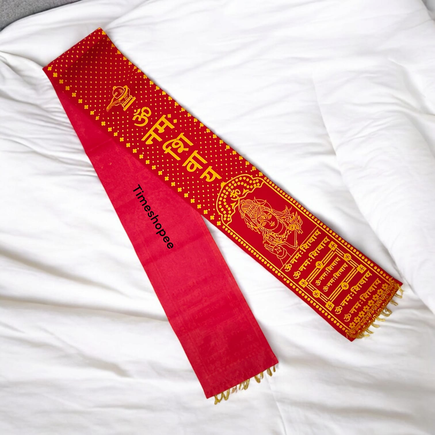 A pure satin stole with red and golden prints of the "Om Namah Shivay" mantra, used for Rudrabhishek and devotional ceremonies.