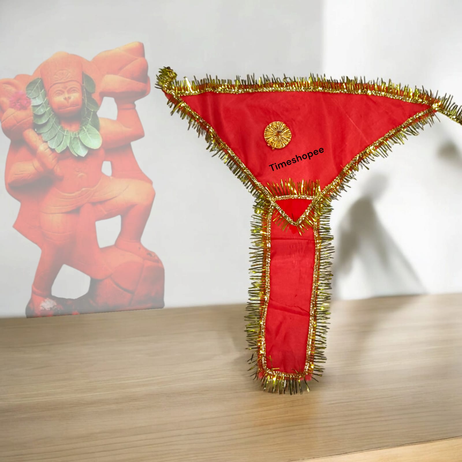 A red 18X18-inch traditional langot for Lord Hanuman, symbolizing strength and devotion, ideal for religious use in temples and home shrines.