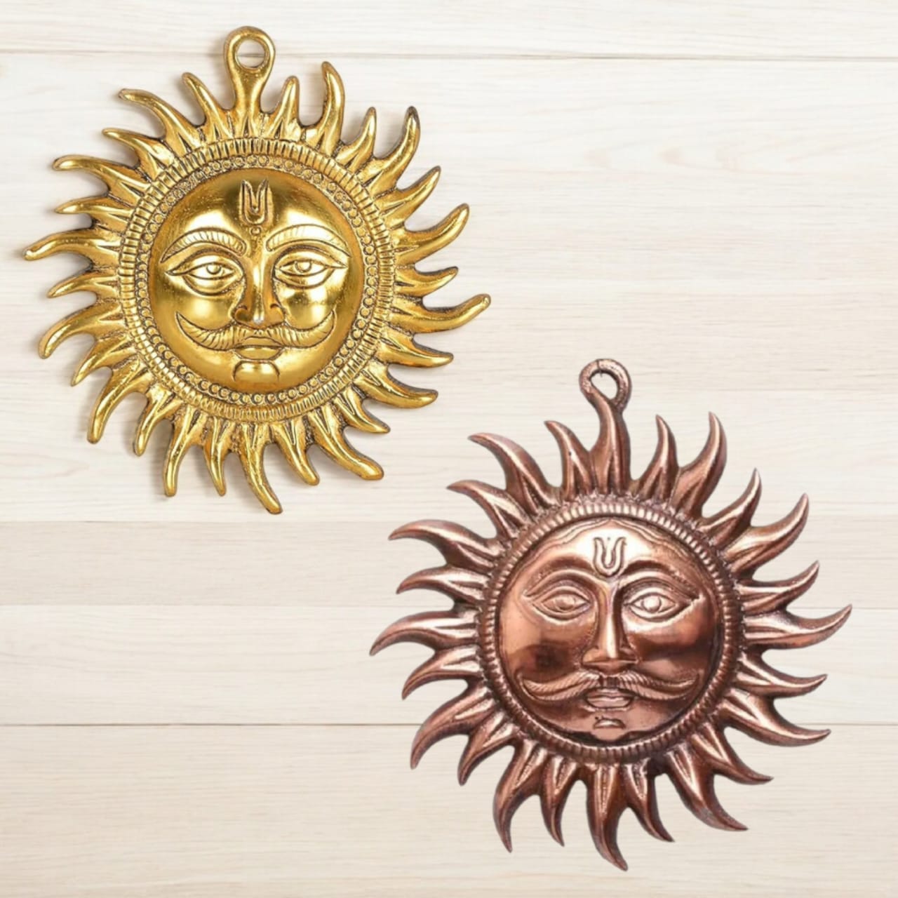 A set of 2 Surya Dev wall hangings, one in bronze (brass) and one in golden (copper), each 7 inches, designed to protect against Vaastu Dosh and Shani Dosh.