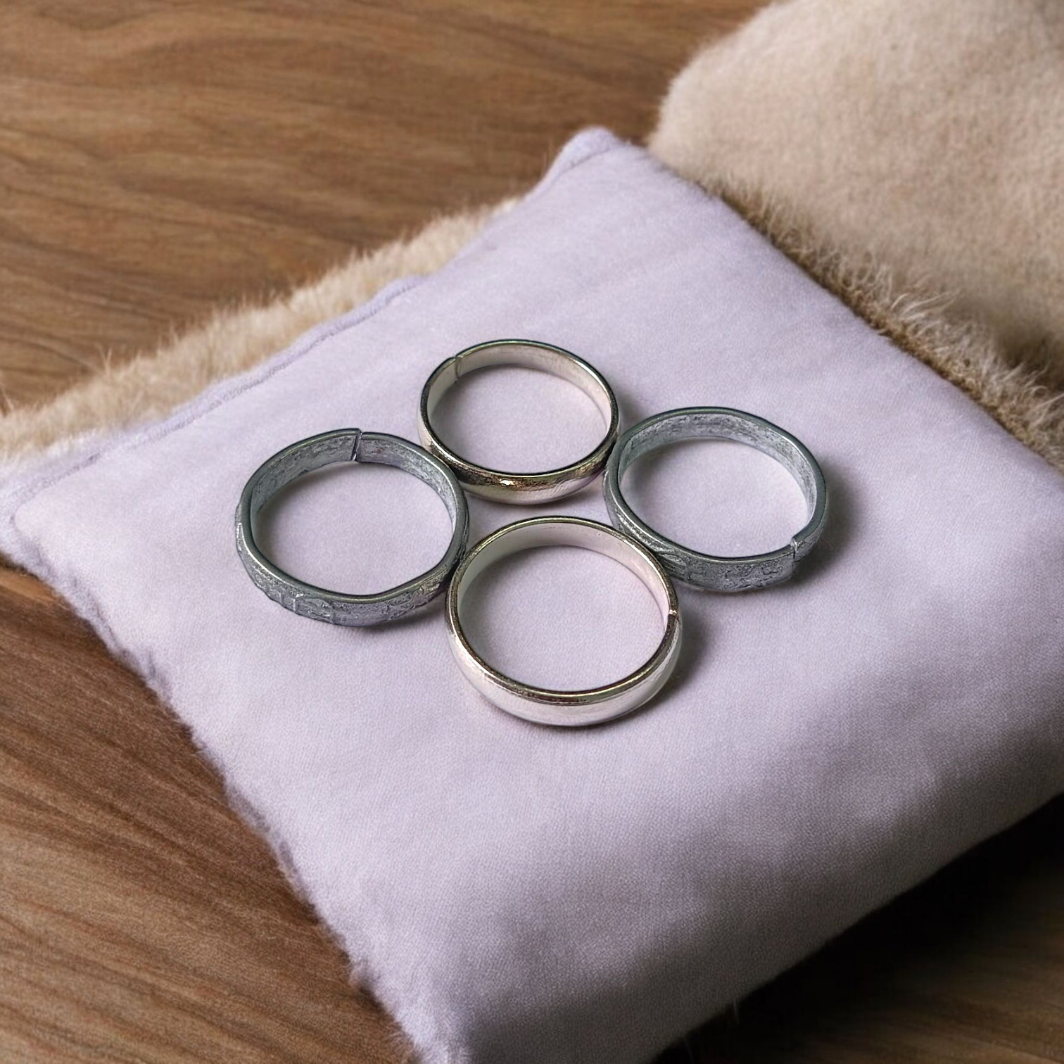 A set of four Ghode Ki Naal ka Challa rings made from black horse shoe nails, each ring designed to mitigate the negative effects of Saturn (Shani). The rings are shown in a close-up view to highlight their craftsmanship and material