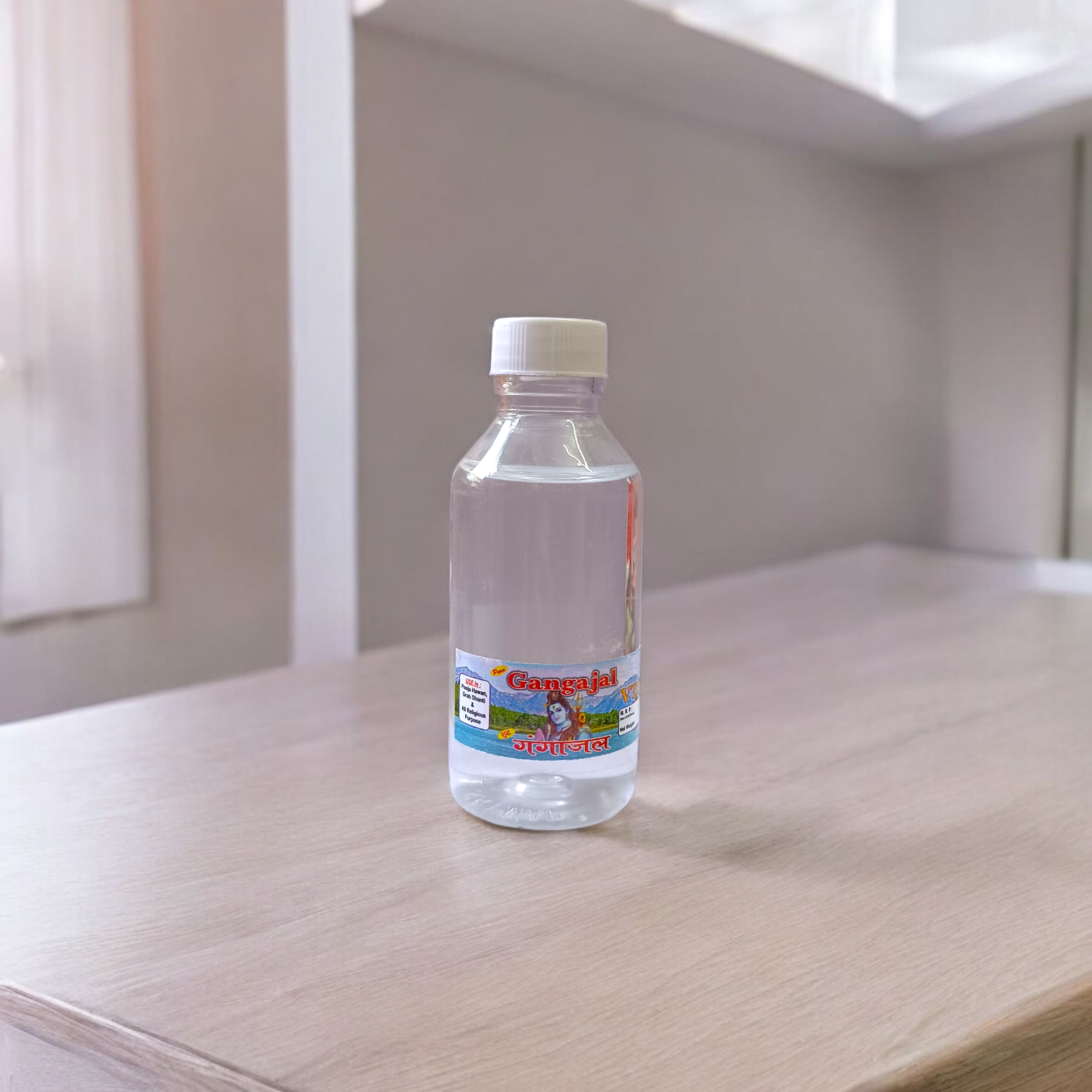A set of two 100g bottles of Pure Gangajal Holy Water placed side by side, labeled for pooja and spiritual use