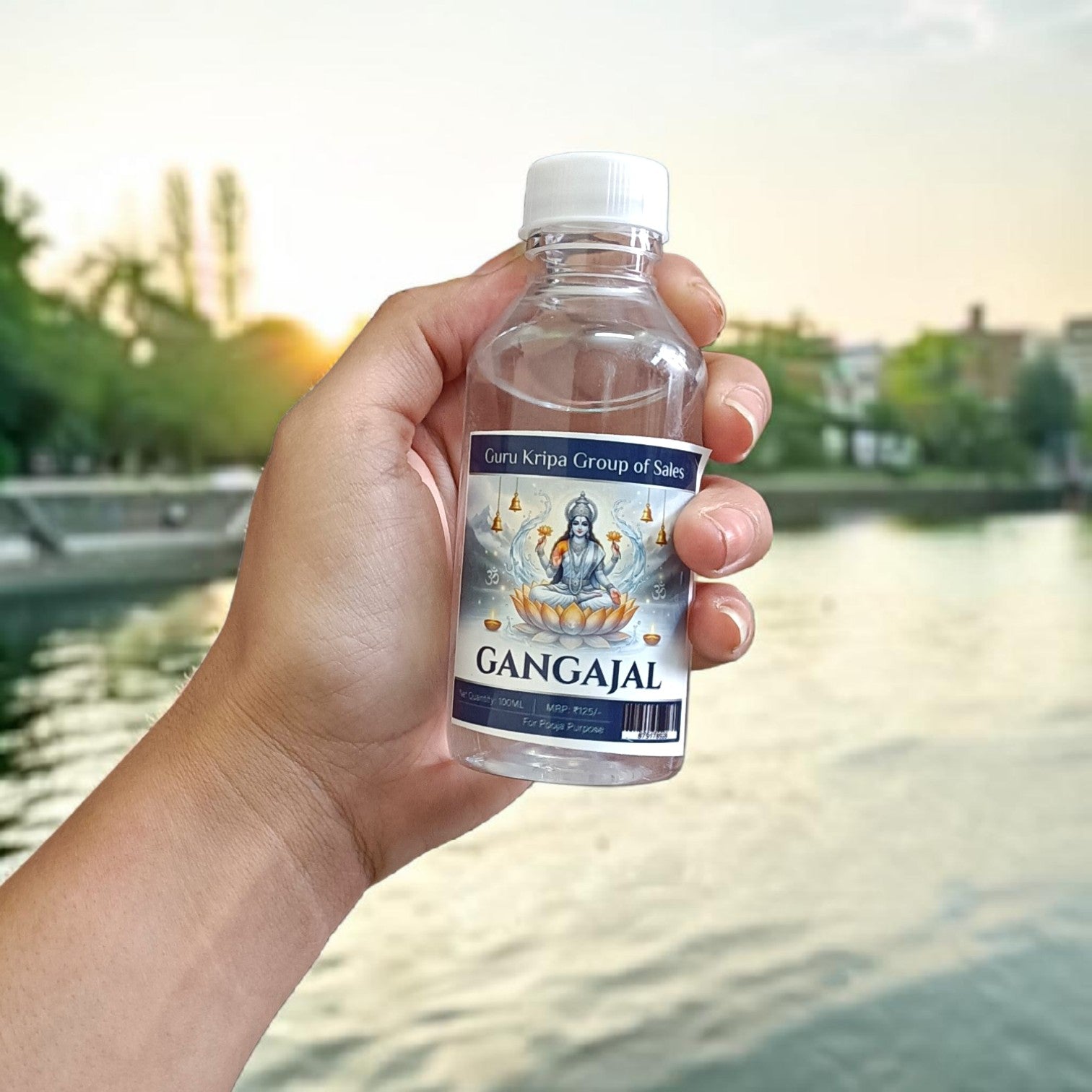 A set of two 100g bottles of Pure Gangajal Holy Water placed side by side, labeled for pooja and spiritual use