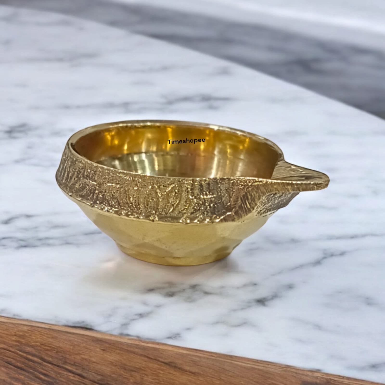 A small 2-inch brass oil lamp with a heavy base, perfect for pooja, festivals, and temple use, featuring a traditional design for stability during rituals.