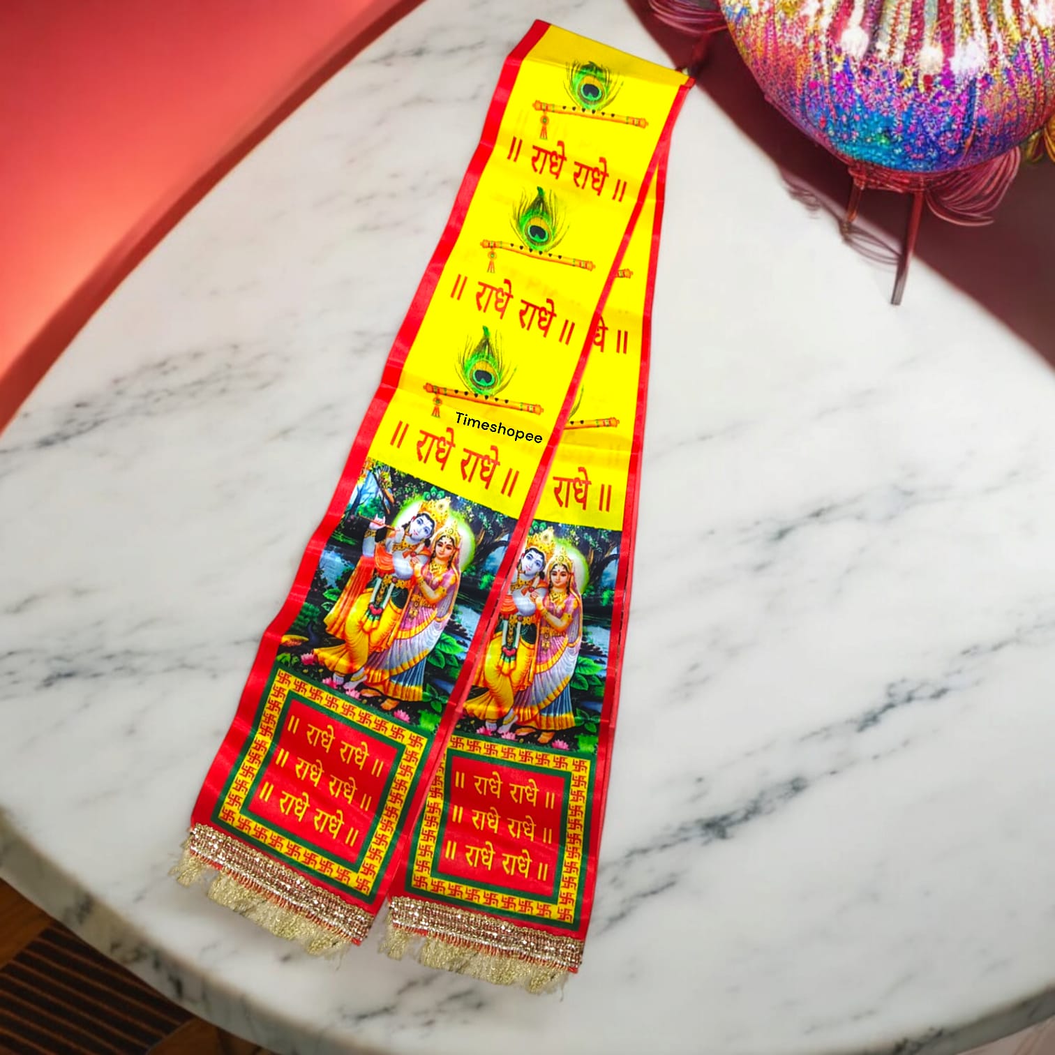 A vibrant satin stole with "Radhe Radhe" print, perfect for pooja and kirtan.
