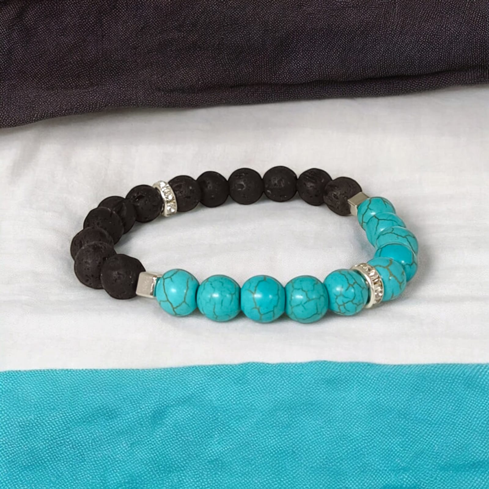 A beautiful Blue Turquoise & Lava Bracelet with 8MM lab-certified beads, stretchable for comfort, combining the healing properties of Turquoise and Lava stones.