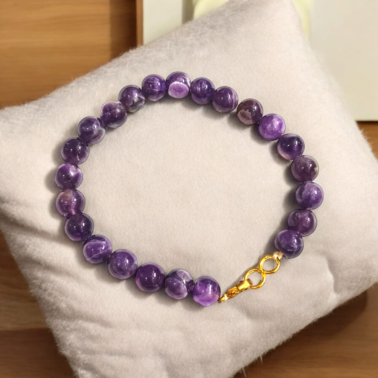 Amethyst bracelet with 8MM beads, showcasing its elegant design and lab certification.