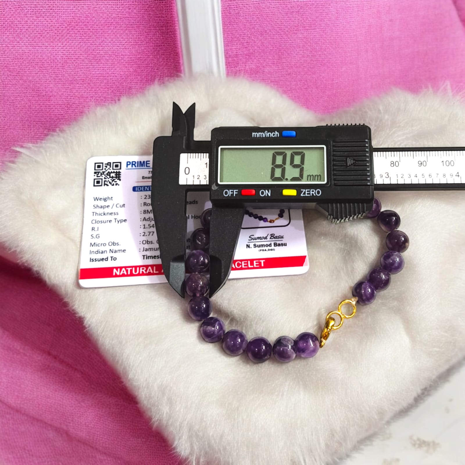 Amethyst bracelet with 8MM beads, showcasing its elegant design and lab certification.