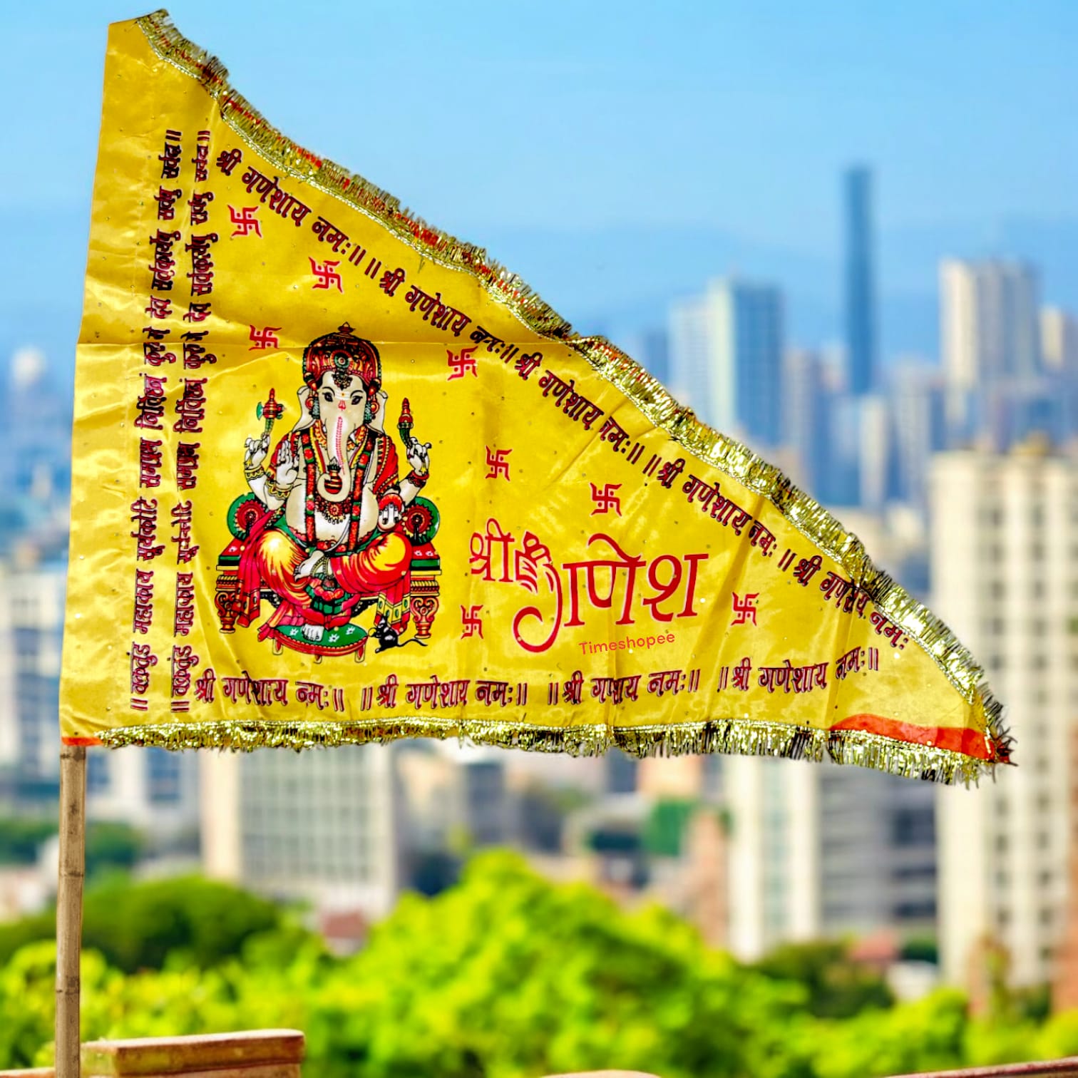 An orange and yellow Ganesh Ji Jhanda featuring Lord Ganesh, available in various sizes for home, office, and temple display.