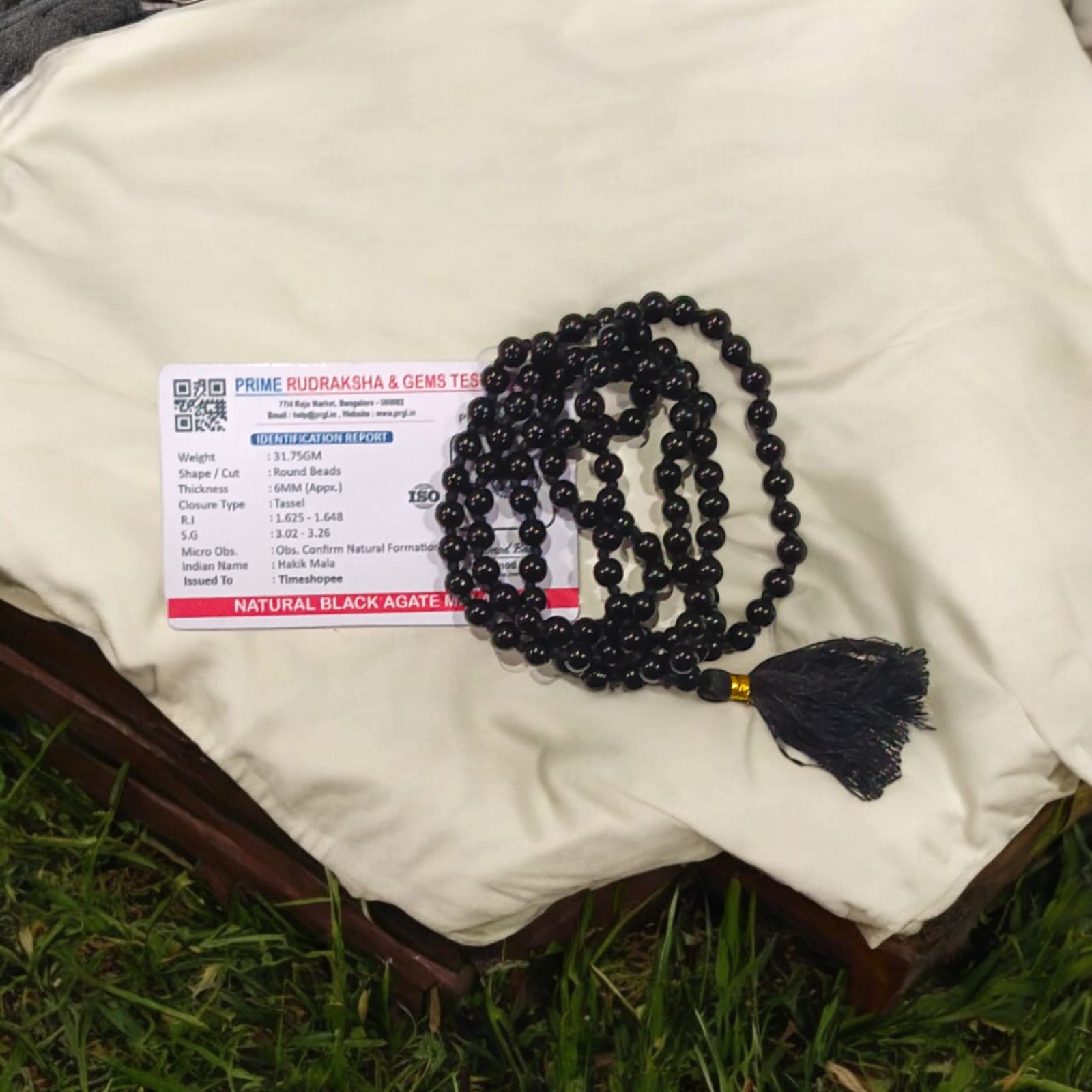 Black Hakik Mala with 6MM beads, 108+1 beads, lab-certified for authenticity, shown in a close-up view.