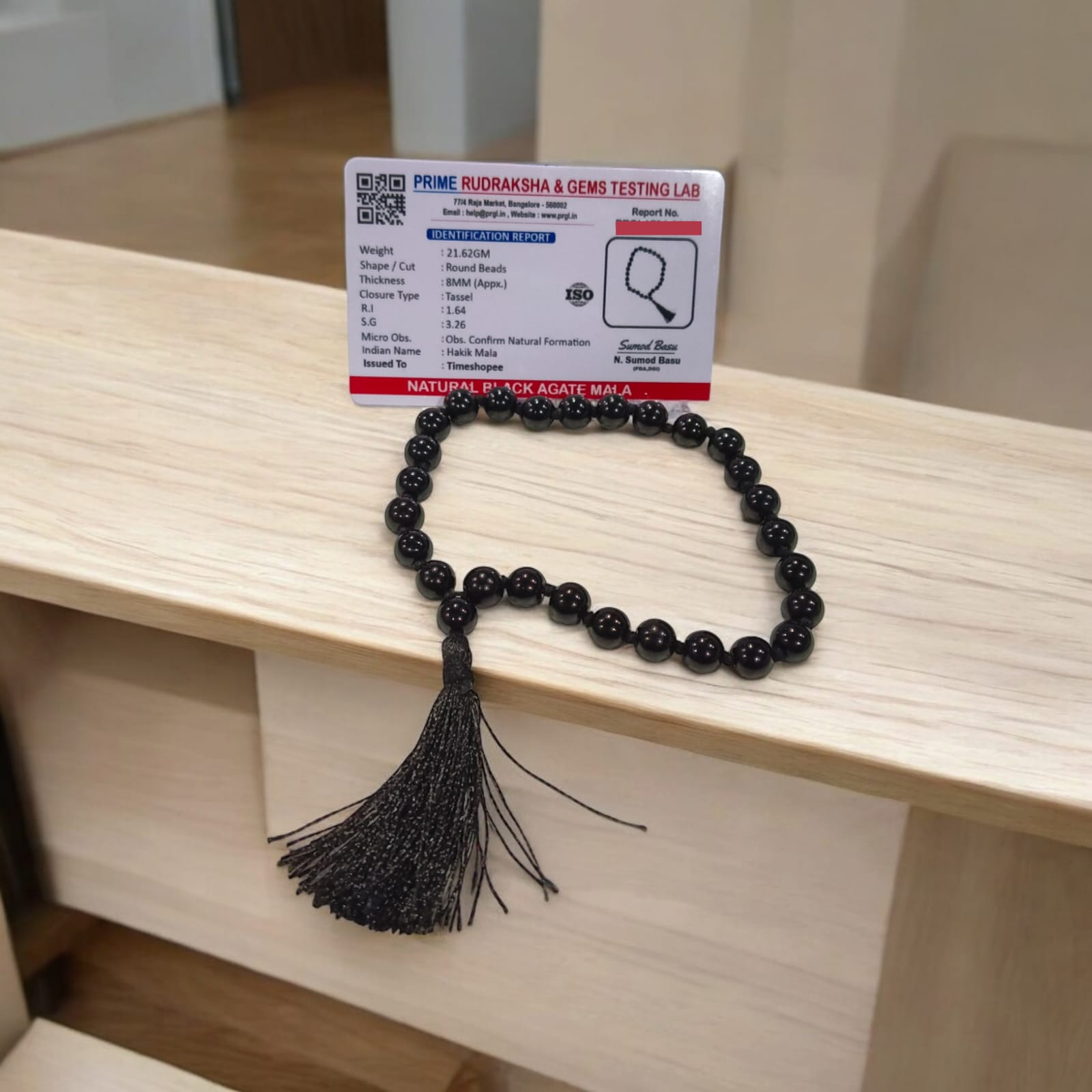 Black Hakik Mala with 8MM beads and 27+1 bead count, lab-certified for authenticity, shown in a convenient, easy-to-carry design.