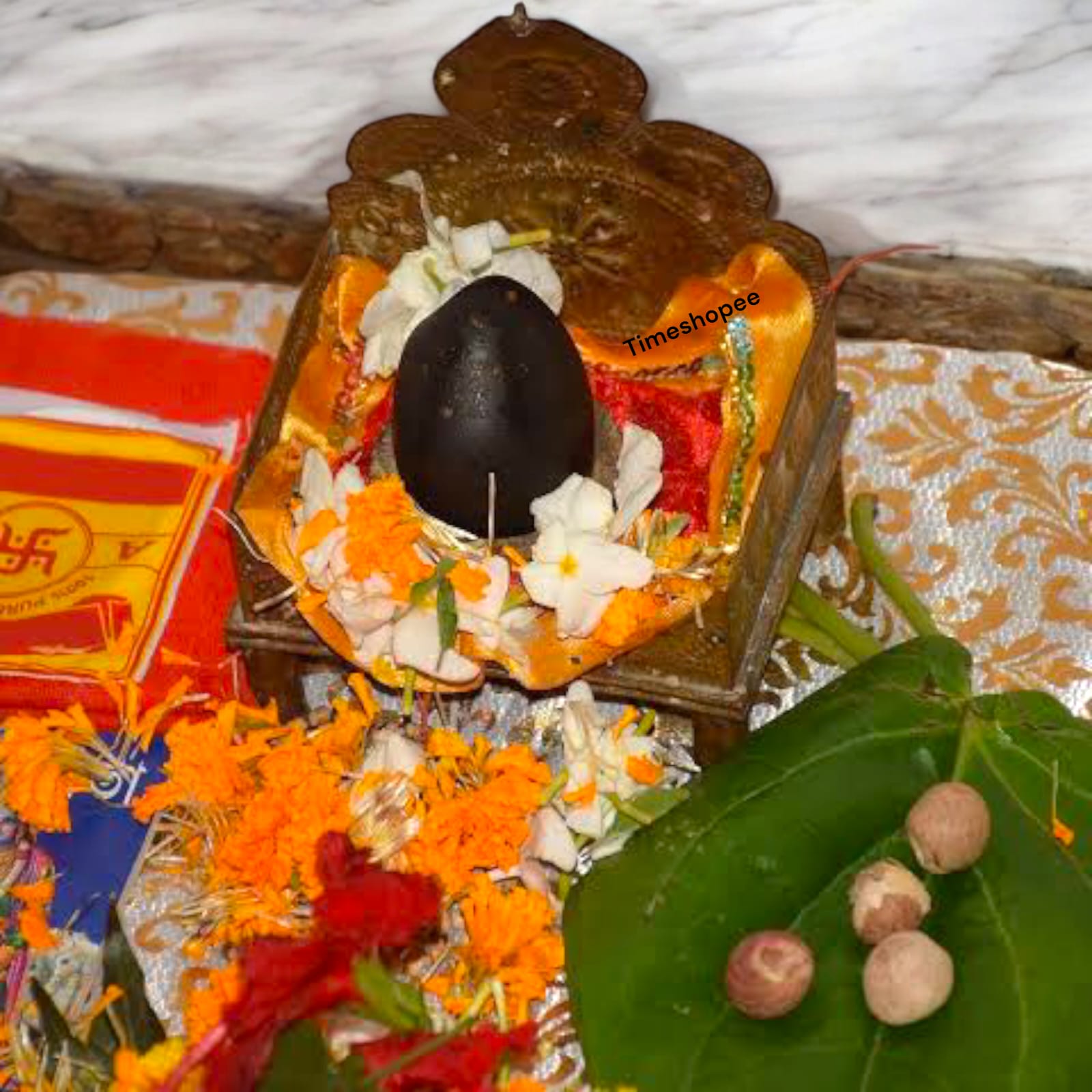 Black Shivling Stone for Tulsi and temple use, symbolizing strength and divine energy with unique natural patterns.