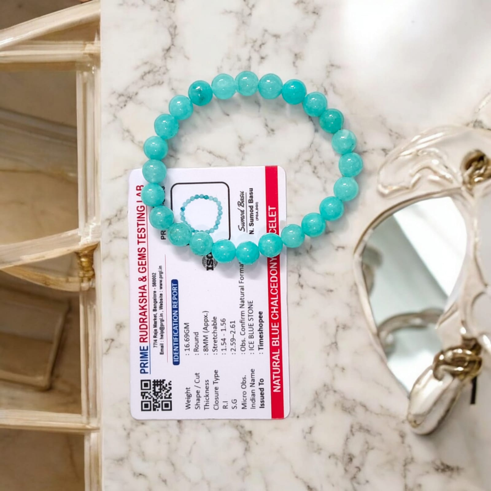 Blue Chalcedony Bracelet with lab certification, showcasing the stretchable design and soothing blue crystal.