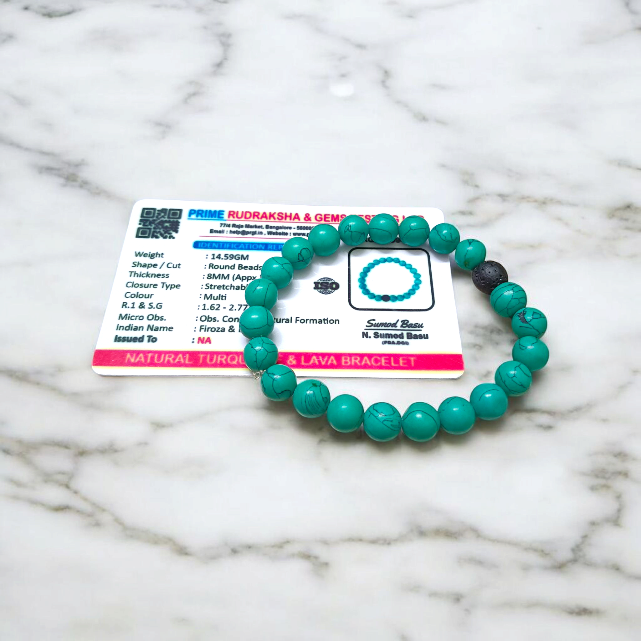 Bracelet made of 8mm natural turquoise and black lava stone beads, arranged on stretchable thread and displayed on a minimal, clean background