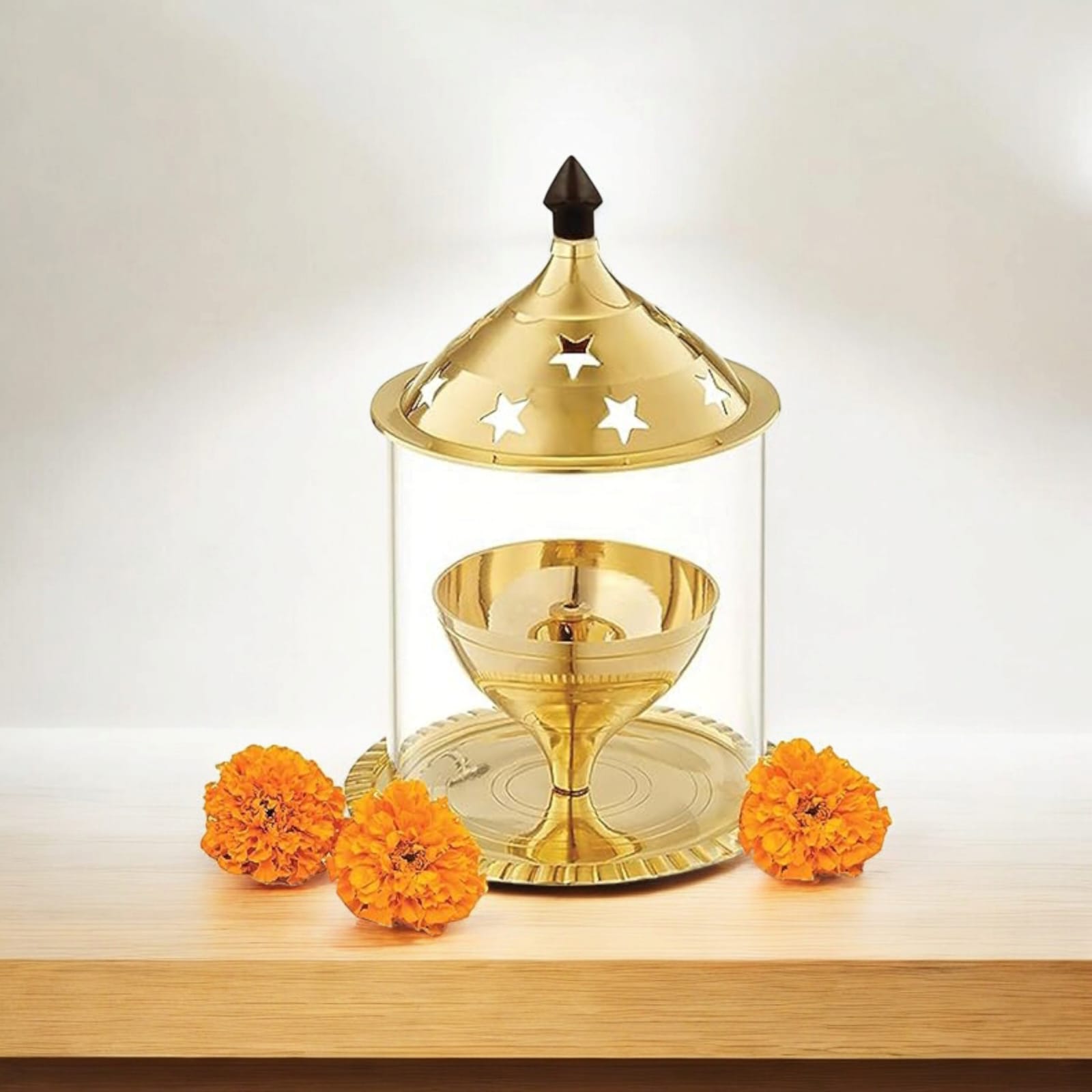 Brass Akhand Jyot with borosilicate glass, available in two sizes, designed for burning desi ghee, with a protective glass cover for steady flame.