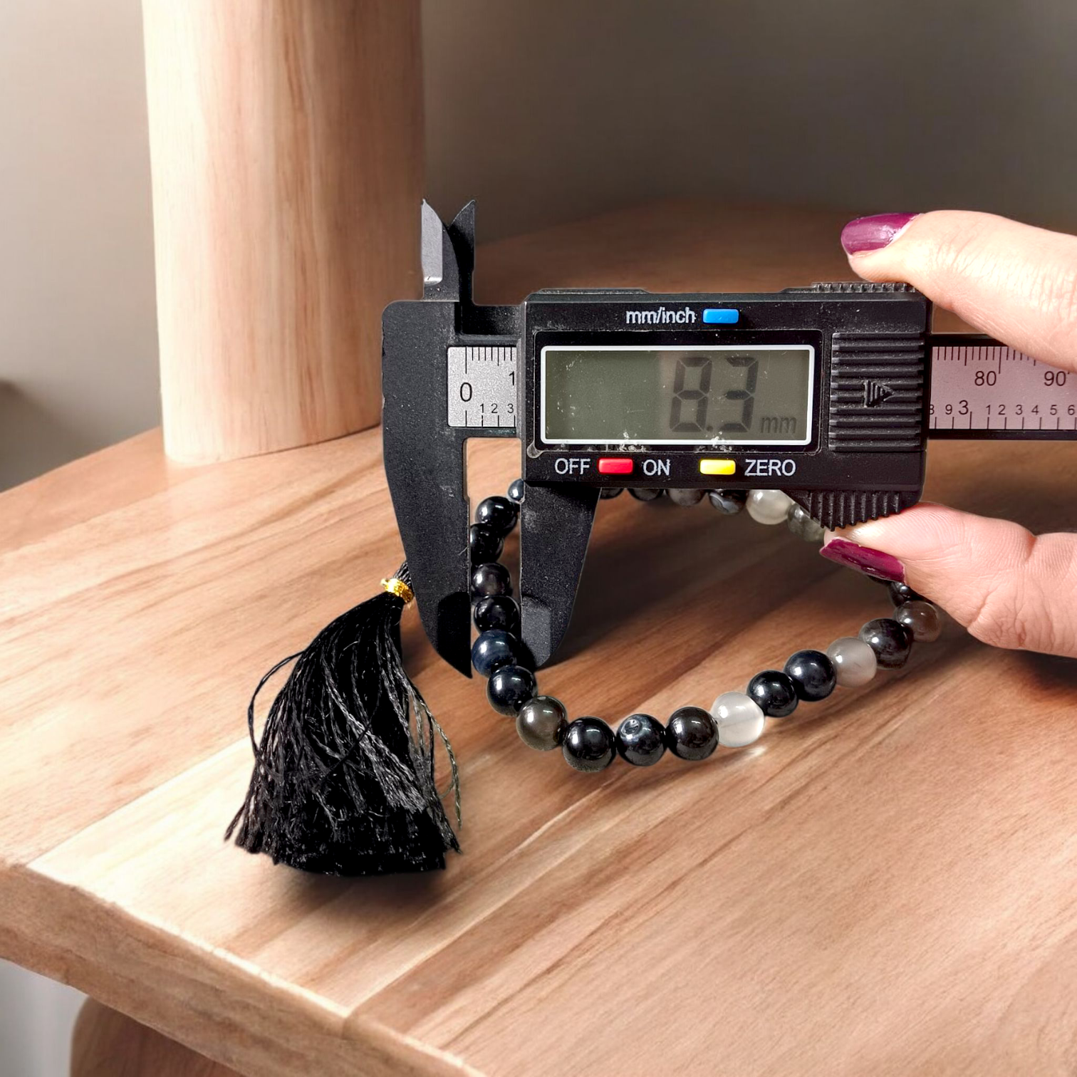 Close-up image of Natural Sulemani Hakik Mala (Black Agate) with 27+1 round beads, 8MM in size, used for Japa, meditation, and daily spiritual protection