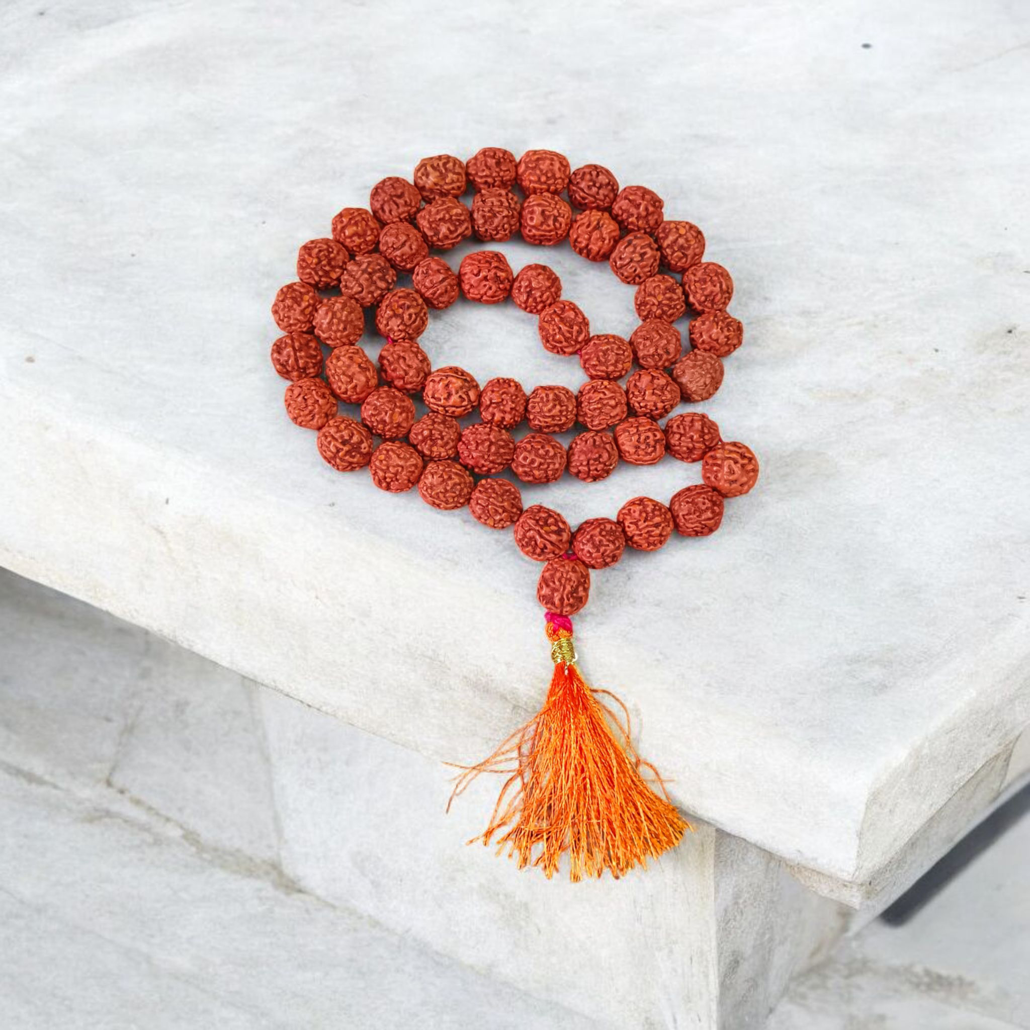 Close-up image of a 5 Mukhi Rudraksha Mala with 54+1 natural brown beads (10-11mm), arranged for Jaap and spiritual use