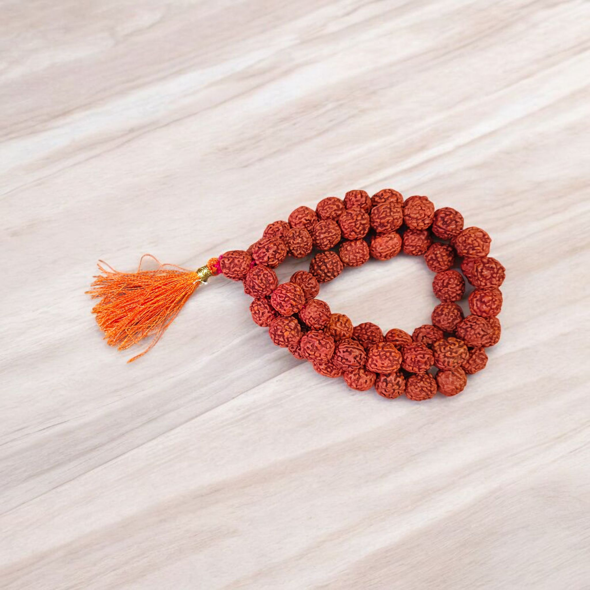 Close-up image of a 5 Mukhi Rudraksha Mala with 54+1 natural brown beads (10-11mm), arranged for Jaap and spiritual use