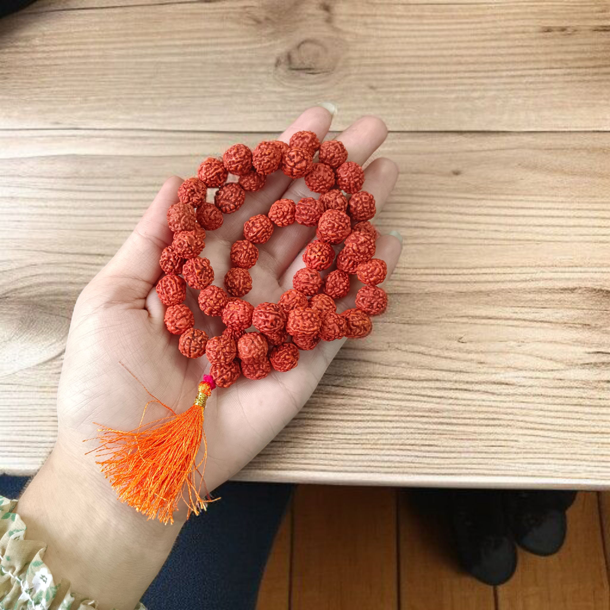 Close-up image of a 5 Mukhi Rudraksha Mala with 54+1 natural brown beads (10-11mm), arranged for Jaap and spiritual use