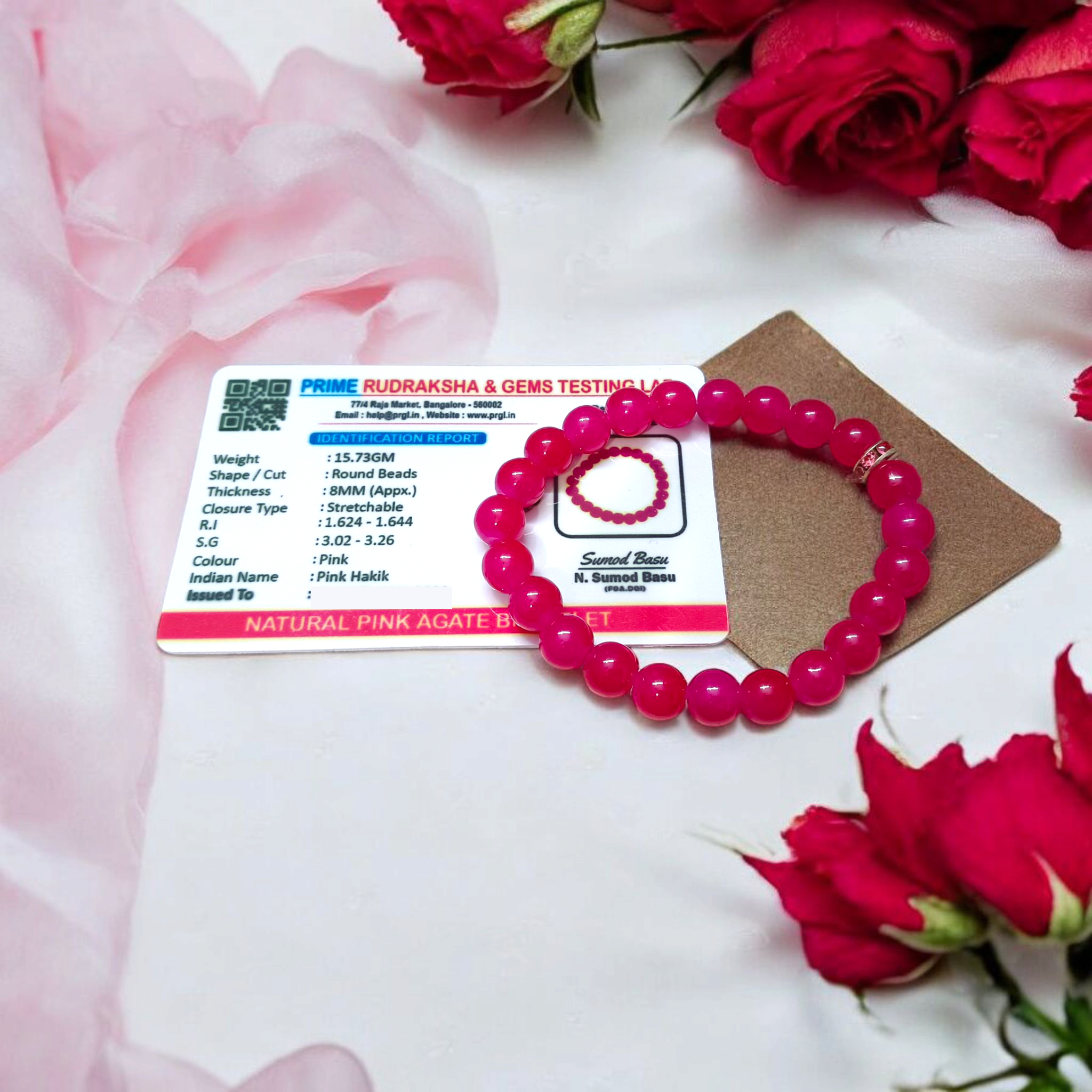 Close-up image of a stretchable bracelet made of natural pink agate (pink hakik) 8mm beads, designed for spiritual and daily wear