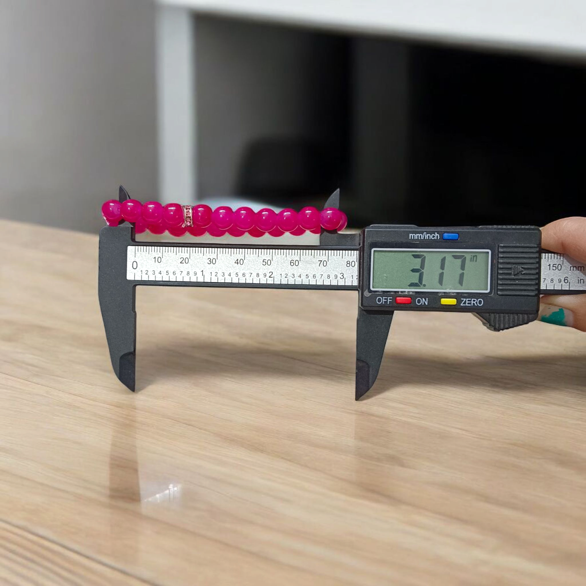 Close-up image of a stretchable bracelet made of natural pink agate (pink hakik) 8mm beads, designed for spiritual and daily wear