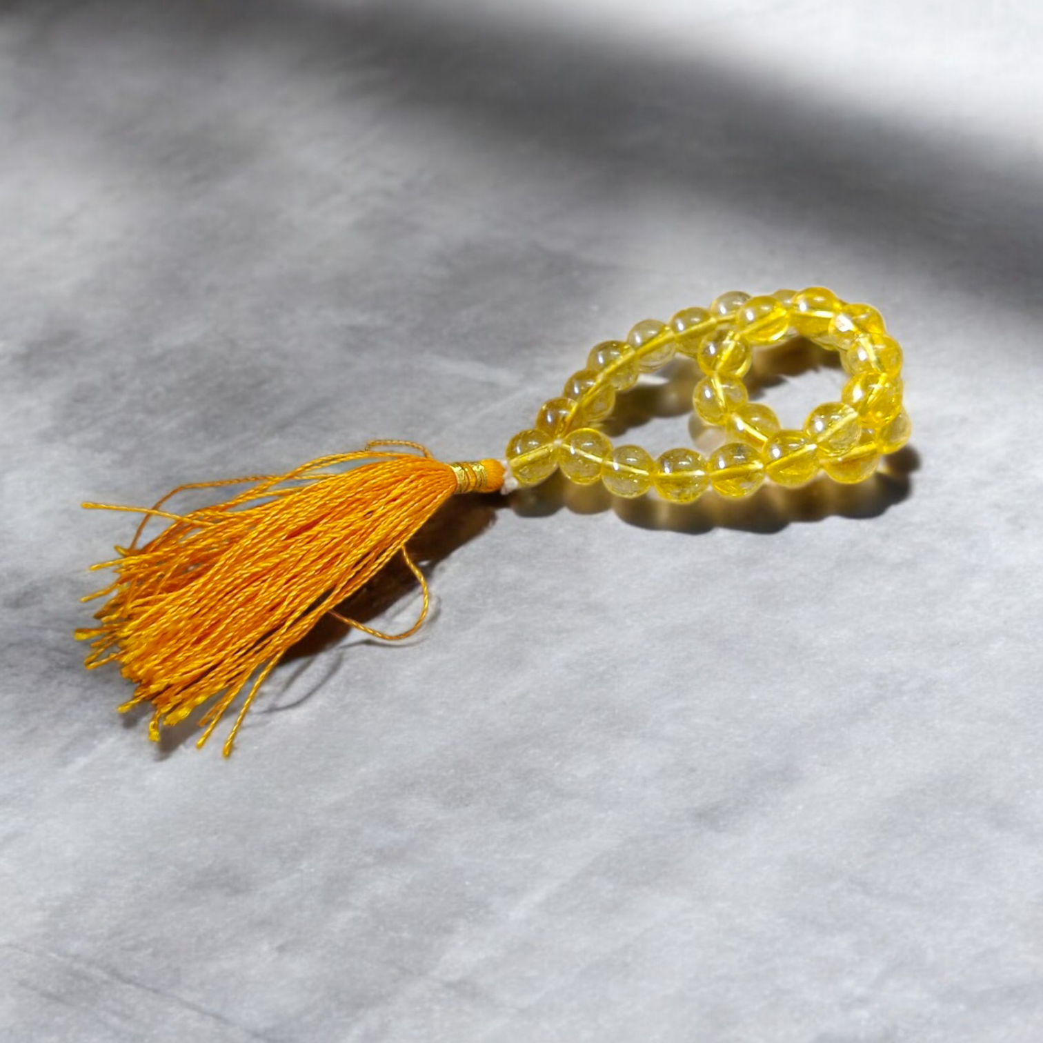 Compact Citrine Mala with 27+1 lab-certified 8mm crystal beads, ideal for chanting, meditation, and travel