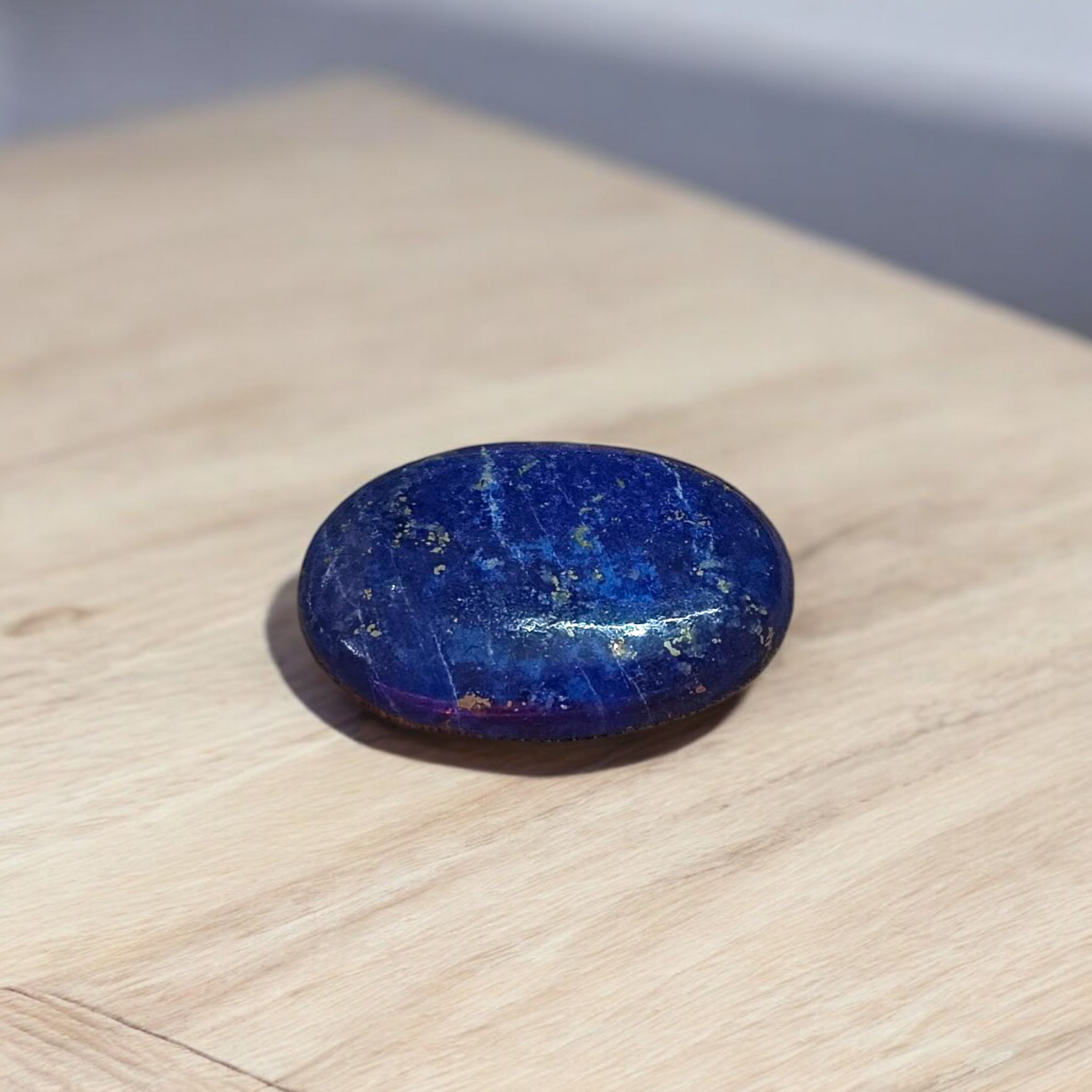 Deep blue Lapis Lazuli stone with golden flecks, used for mental clarity and emotional healing
