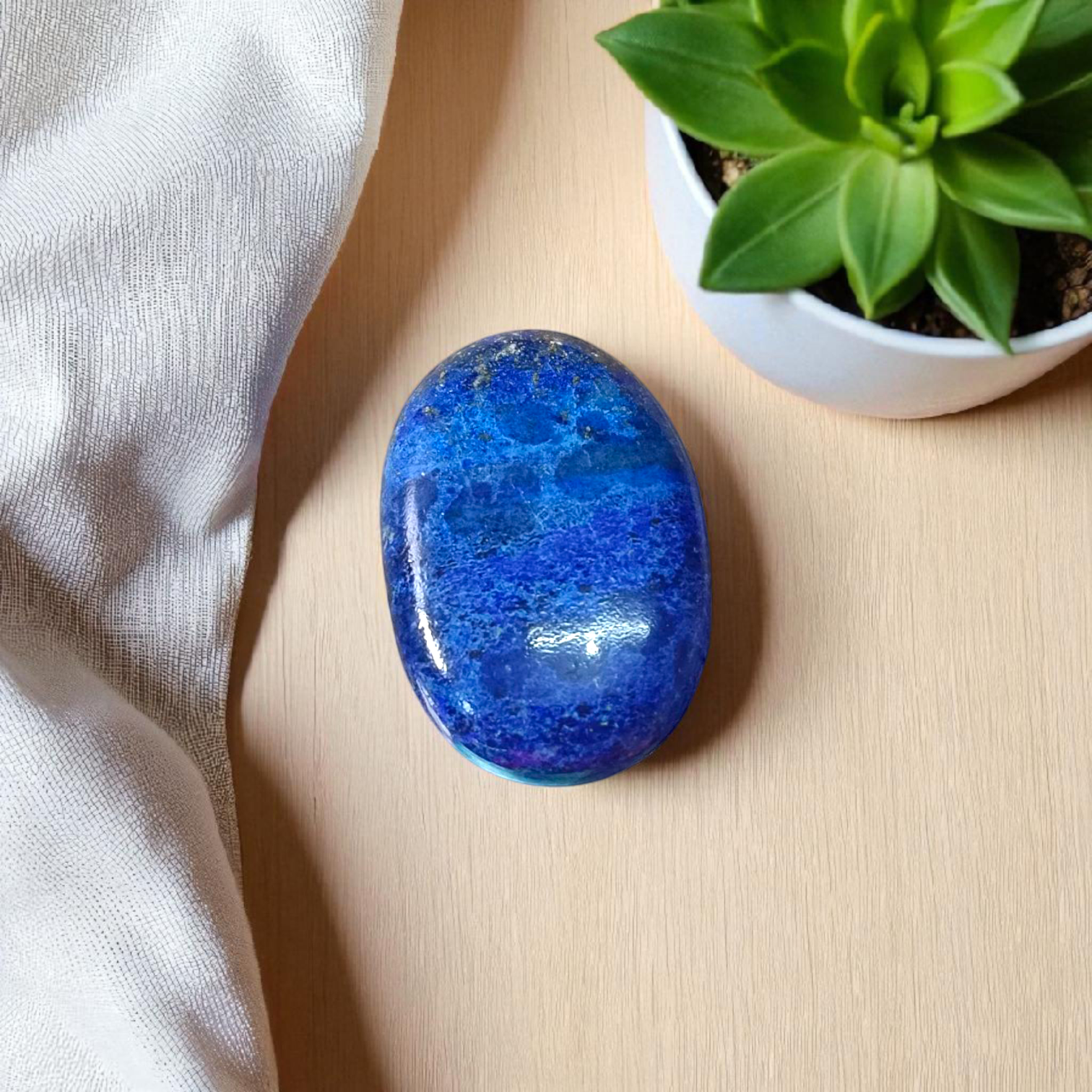 Deep blue Lapis Lazuli stone with golden flecks, used for mental clarity and emotional healing