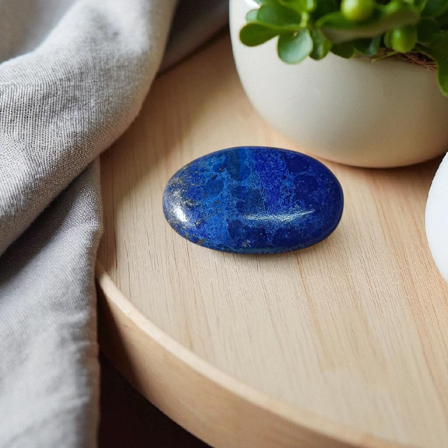 Deep blue Lapis Lazuli stone with golden flecks, used for mental clarity and emotional healing