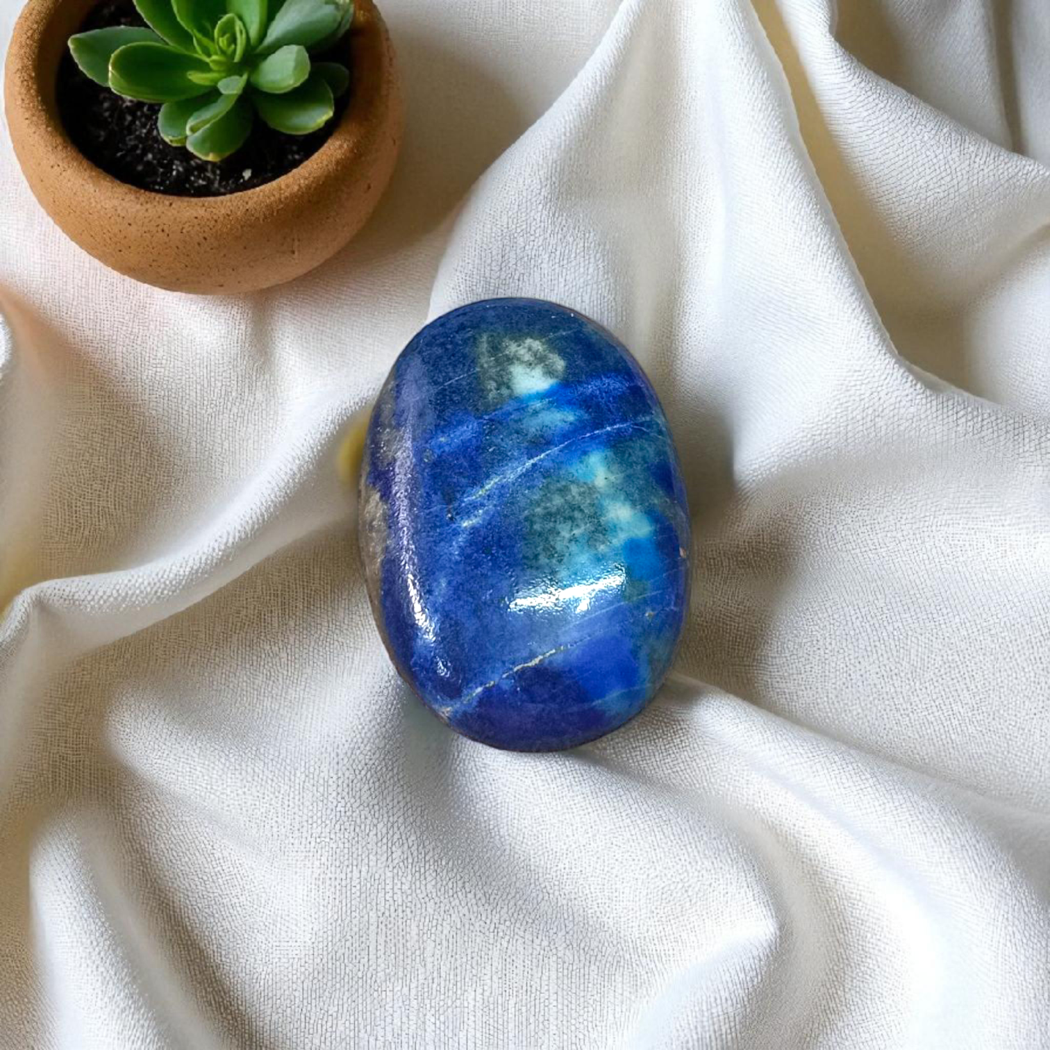 Deep blue Lapis Lazuli stone with golden flecks, used for mental clarity and emotional healing