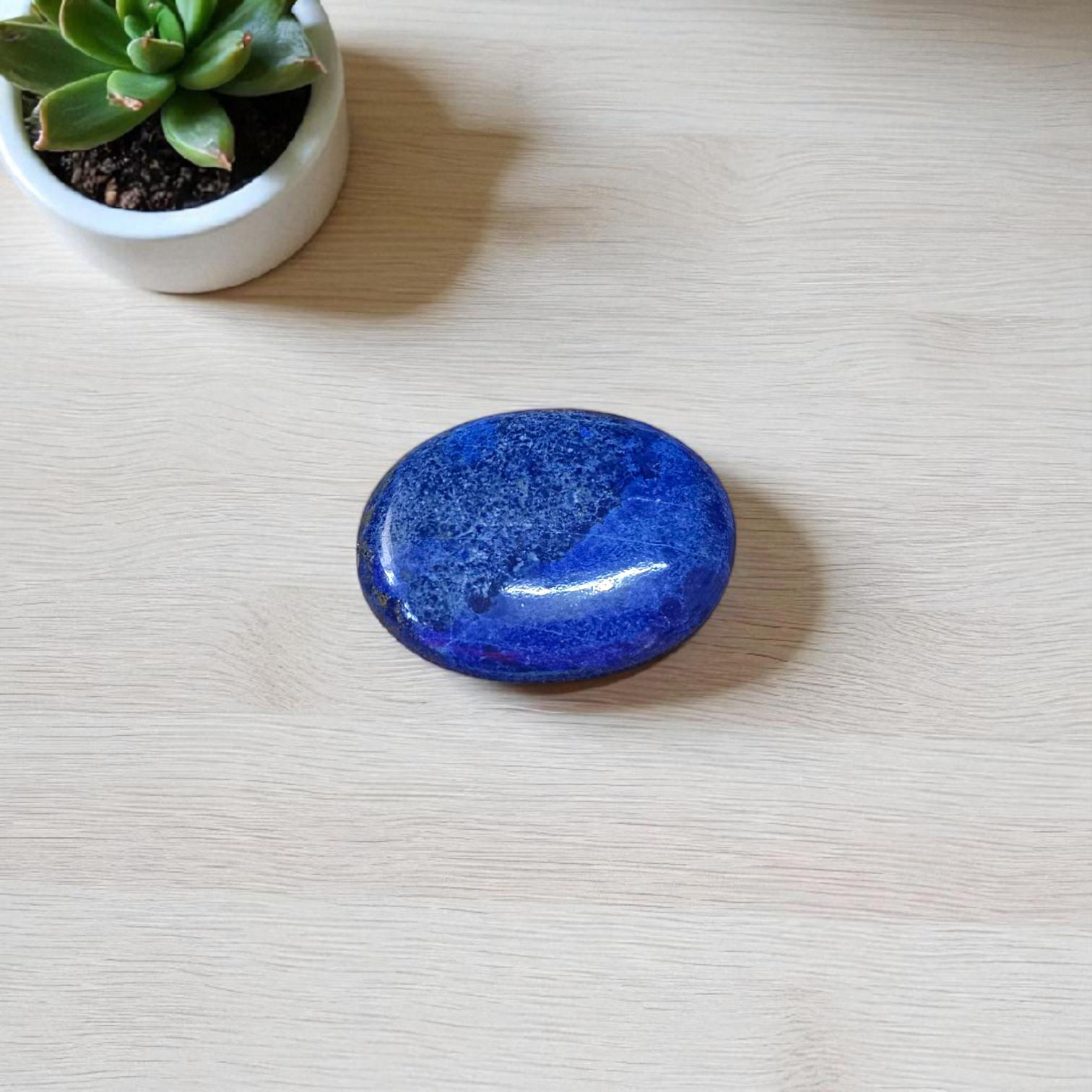 Deep blue Lapis Lazuli stone with golden flecks, used for mental clarity and emotional healing