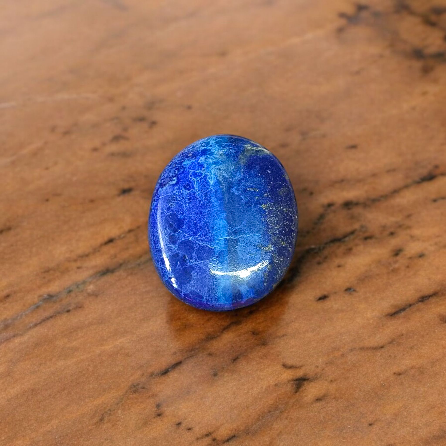 Deep blue Lapis Lazuli stone with golden flecks, used for mental clarity and emotional healing