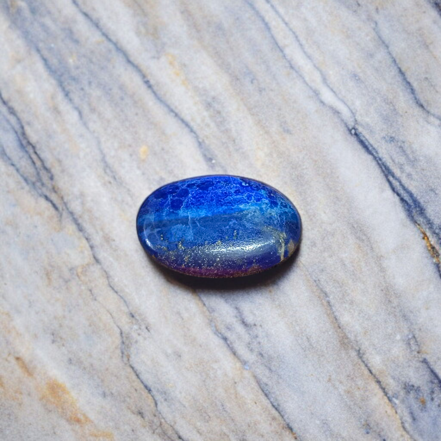 Deep blue Lapis Lazuli stone with golden flecks, used for mental clarity and emotional healing