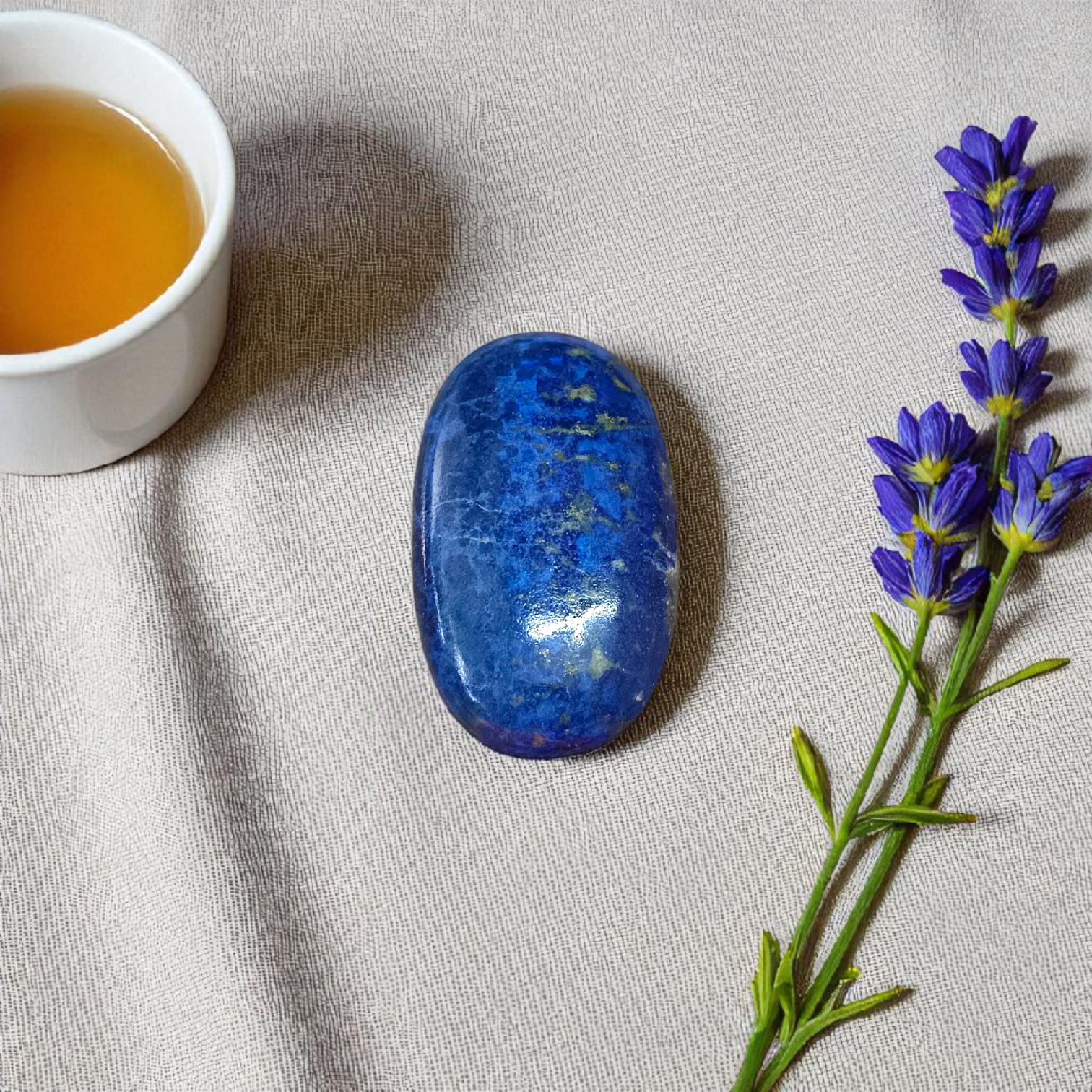 Deep blue Lapis Lazuli stone with golden flecks, used for mental clarity and emotional healing