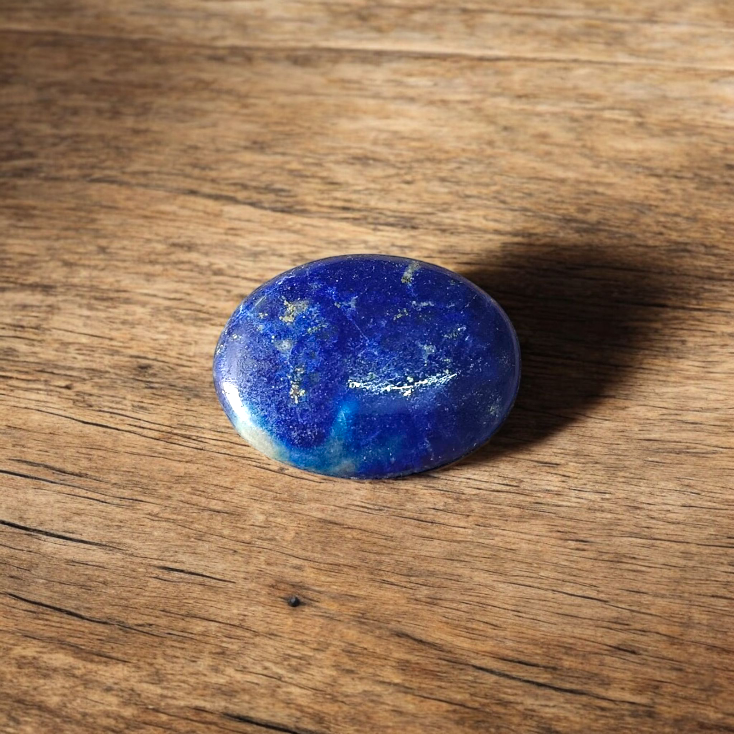 Deep blue Lapis Lazuli stone with golden flecks, used for mental clarity and emotional healing