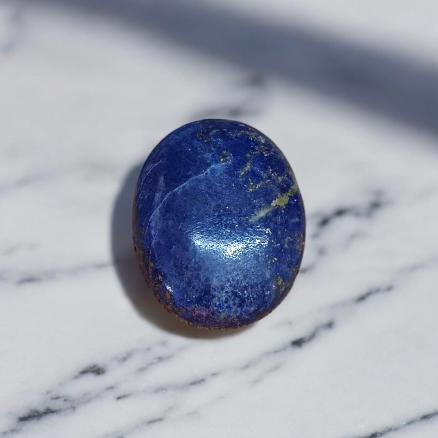Deep blue Lapis Lazuli stone with golden flecks, used for mental clarity and emotional healing