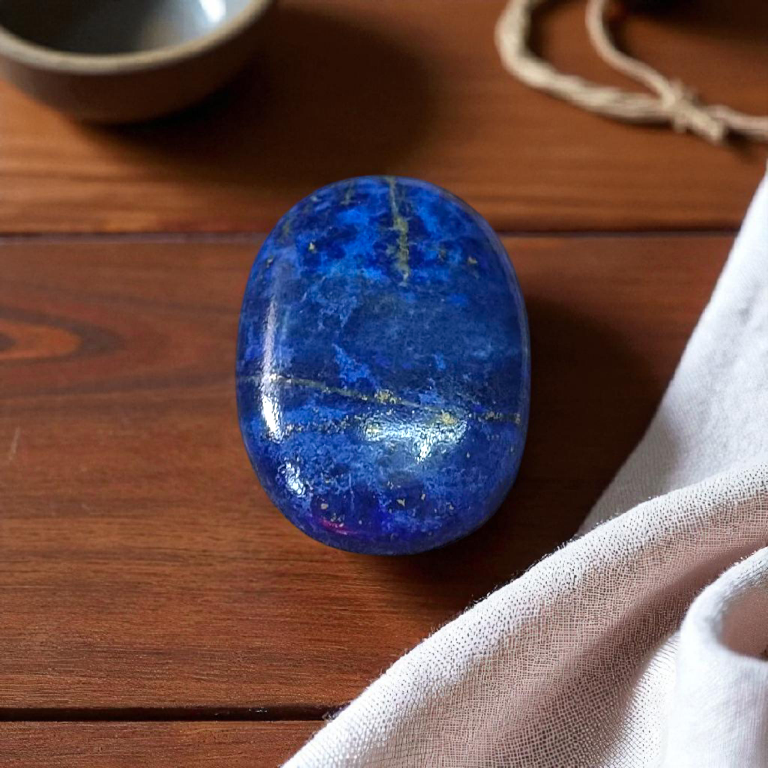 Deep blue Lapis Lazuli stone with golden flecks, used for mental clarity and emotional healing