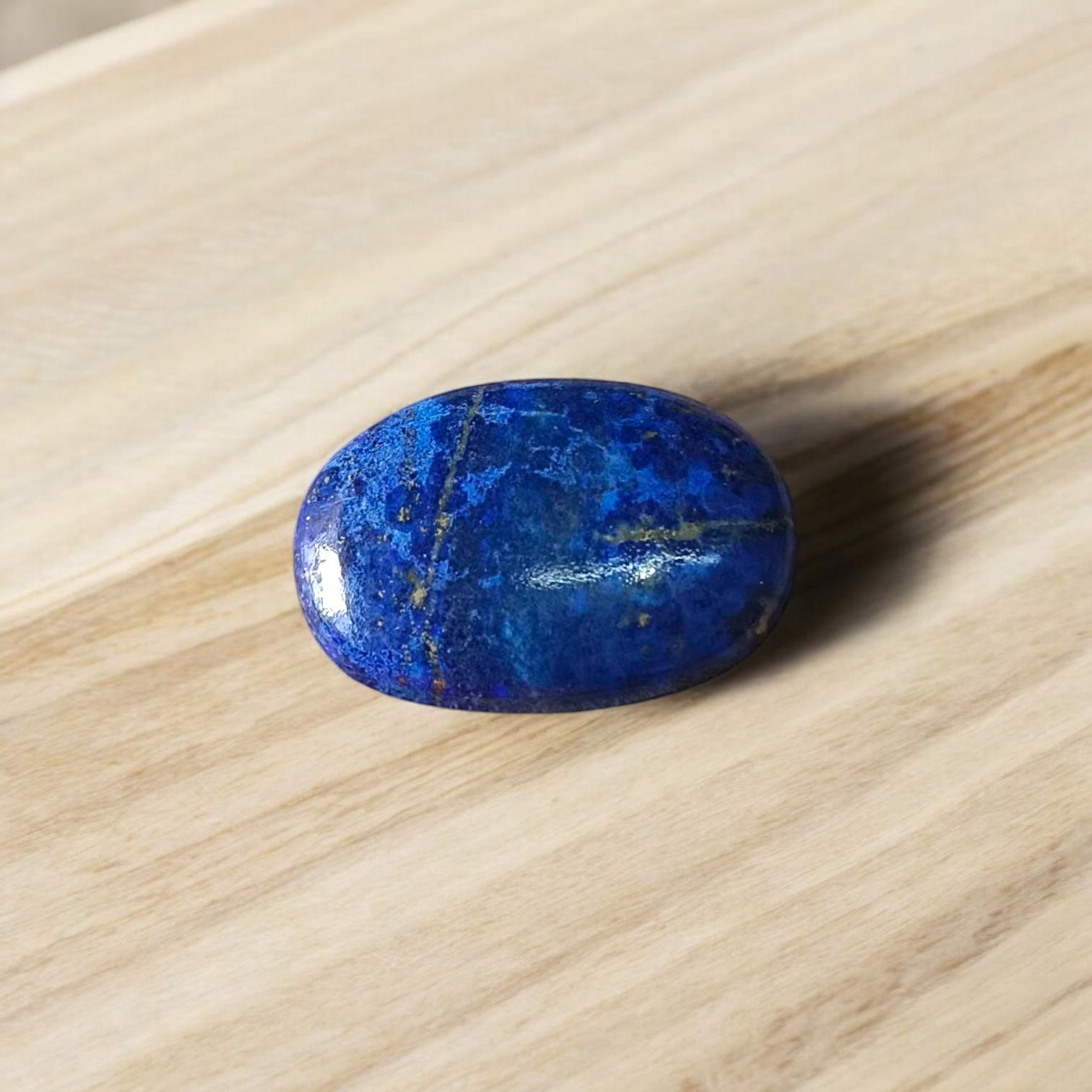 Deep blue Lapis Lazuli stone with golden flecks, used for mental clarity and emotional healing