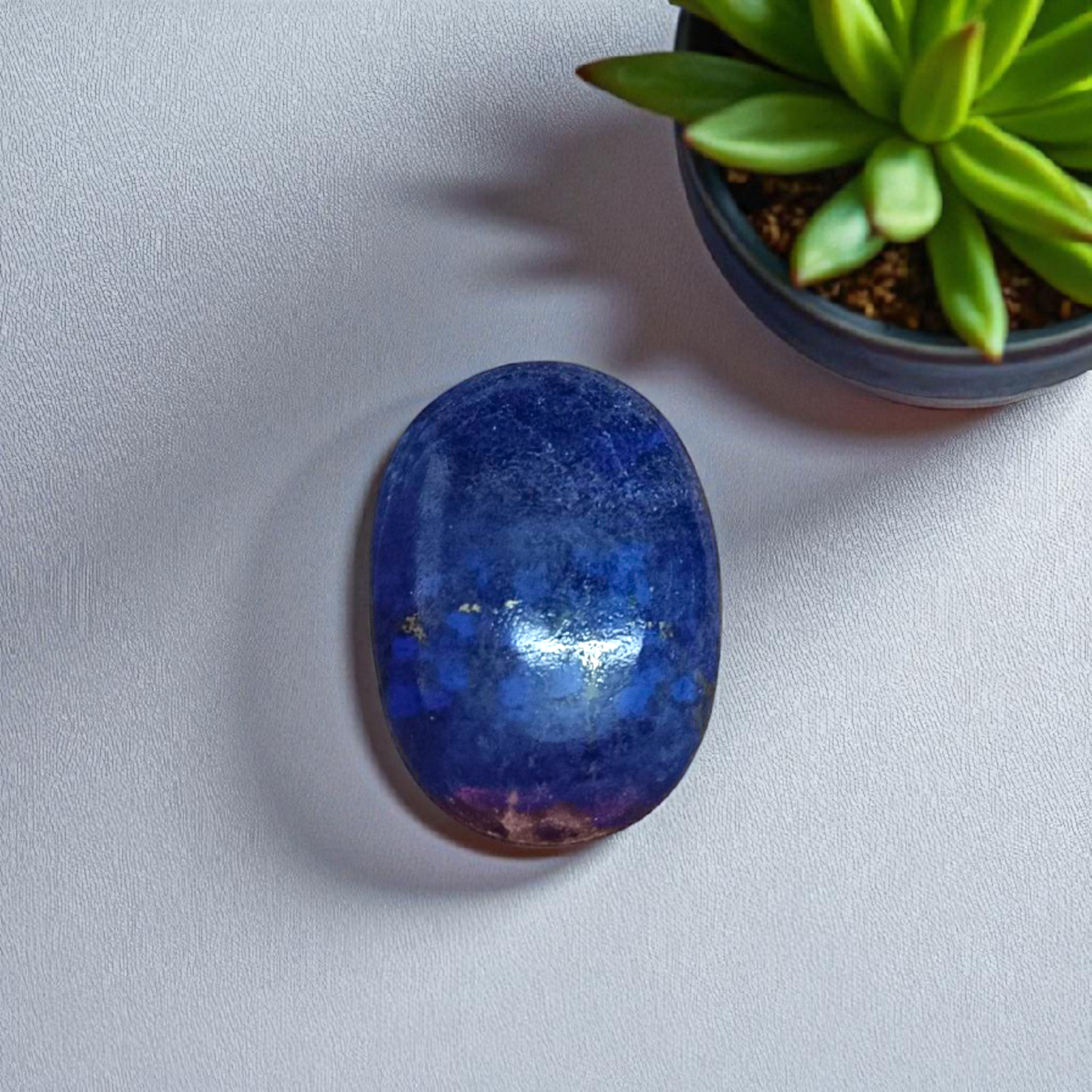 Deep blue Lapis Lazuli stone with golden flecks, used for mental clarity and emotional healing
