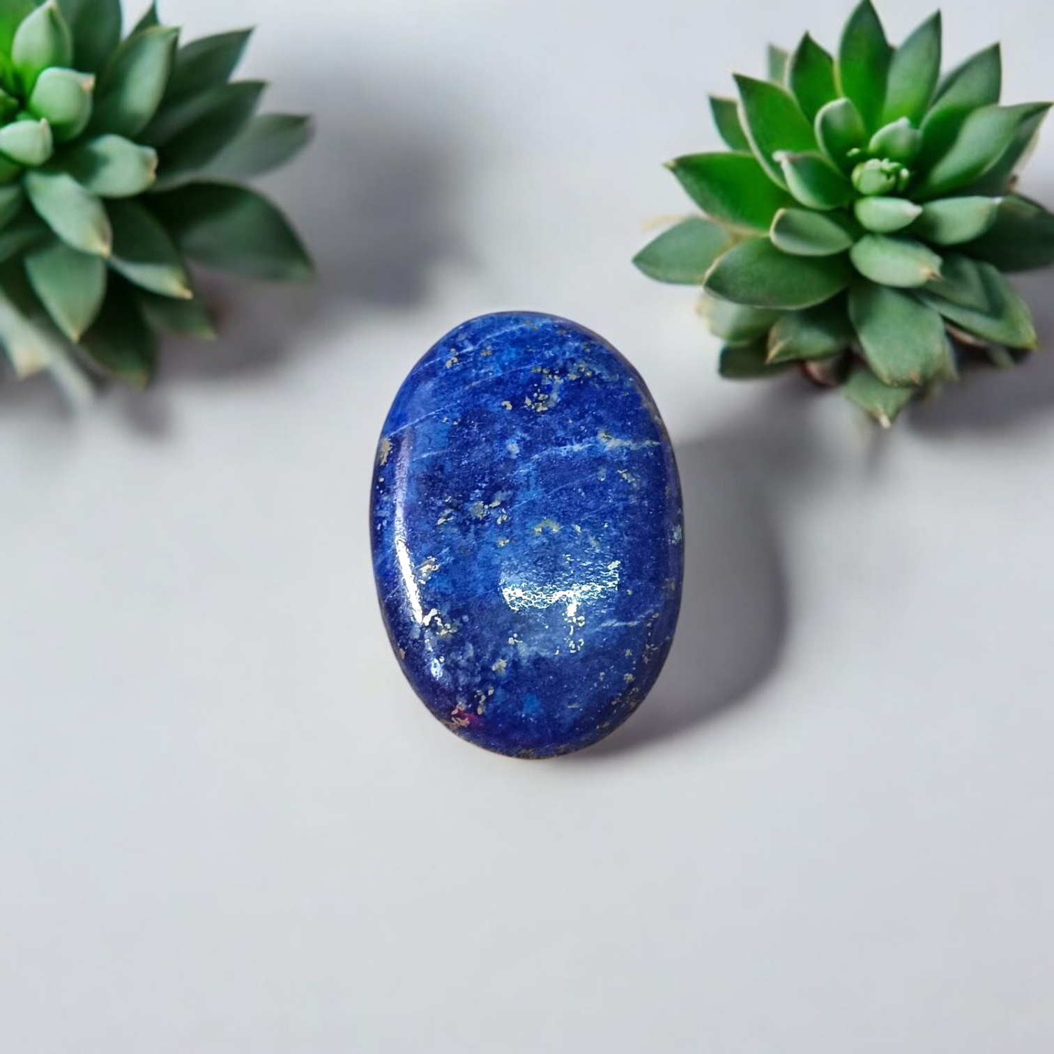 Deep blue Lapis Lazuli stone with golden flecks, used for mental clarity and emotional healing