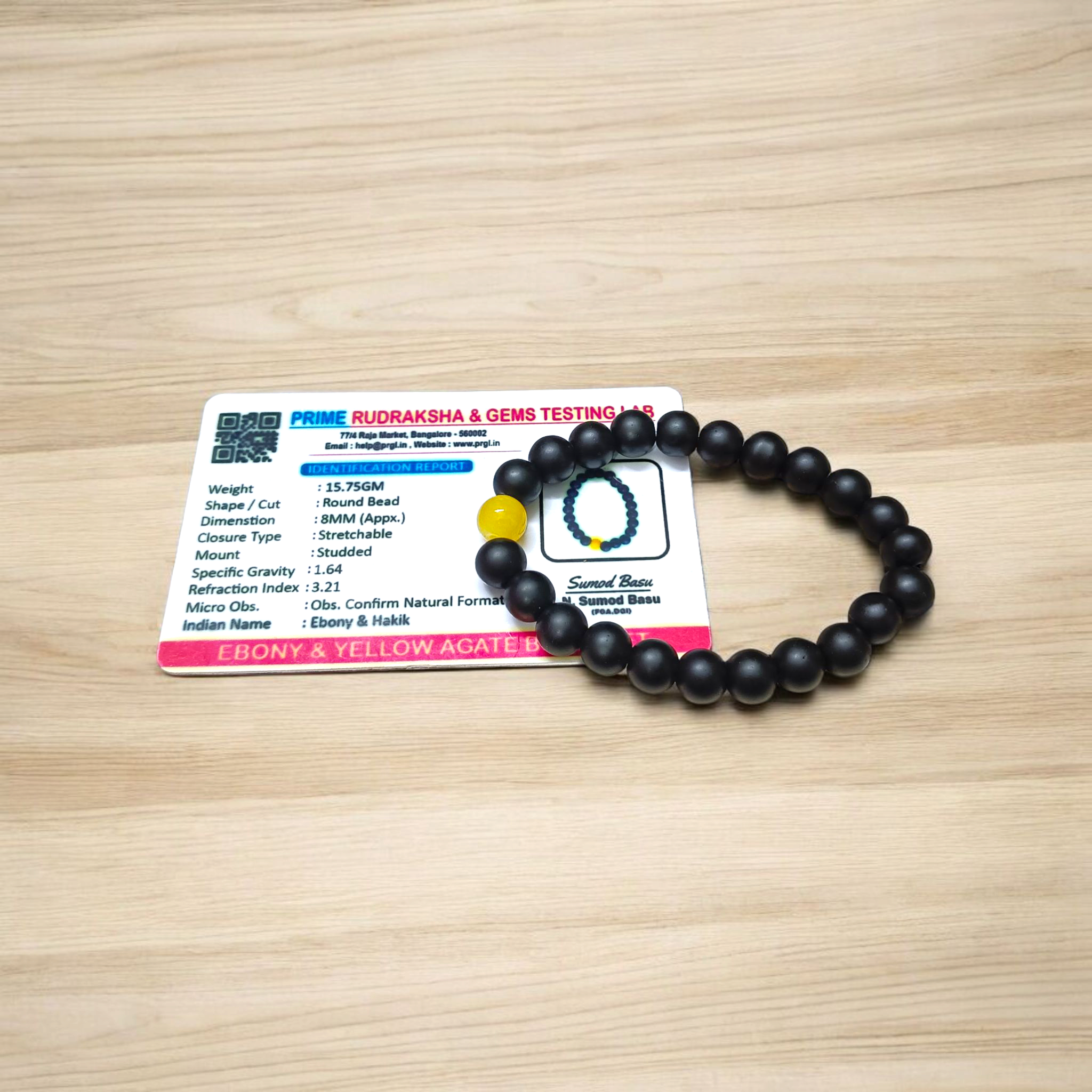 Ebony & Yellow Agate Bracelet with 8mm natural beads, stretchable unisex design placed on a soft white background