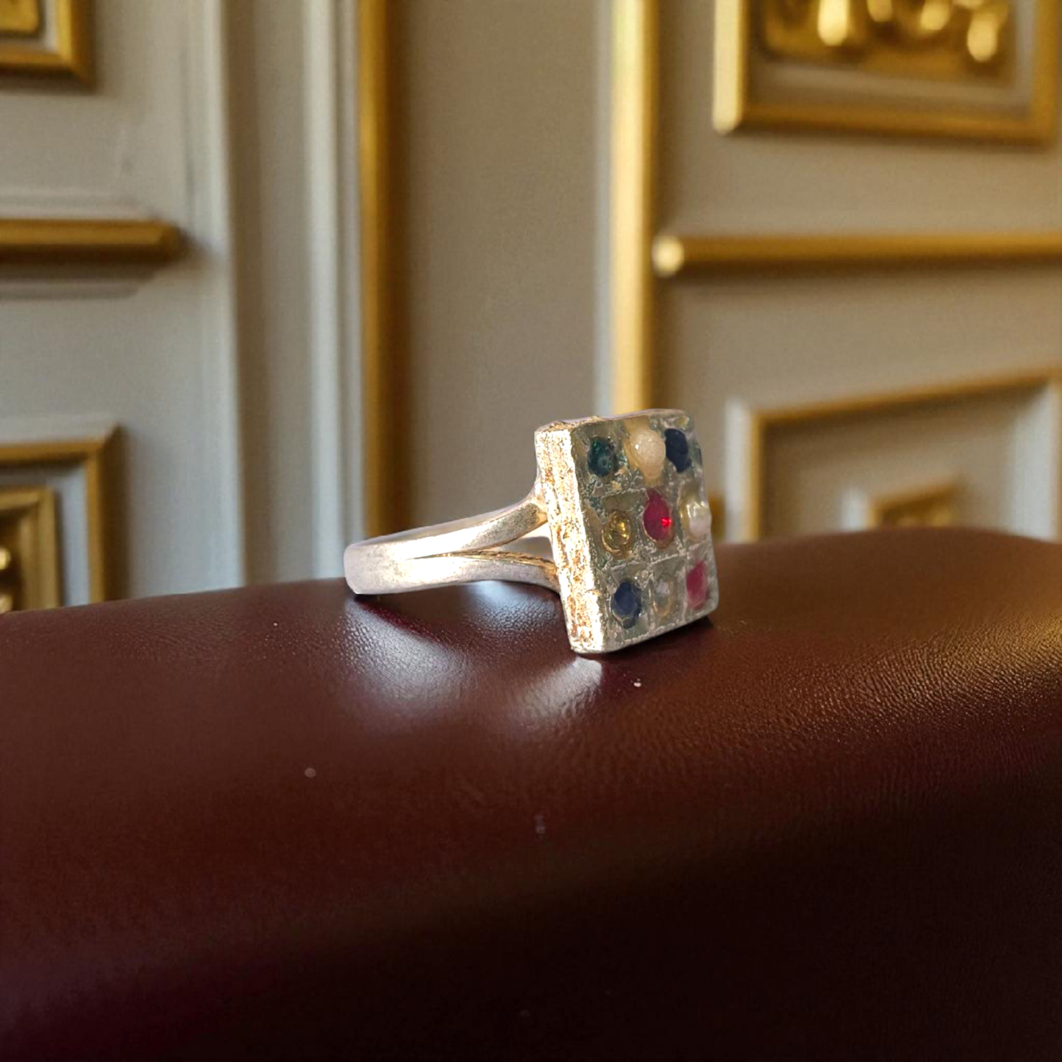 Elegant Navratan ring with a square-shaped design featuring nine vibrant gemstones, available at Timeshopee.