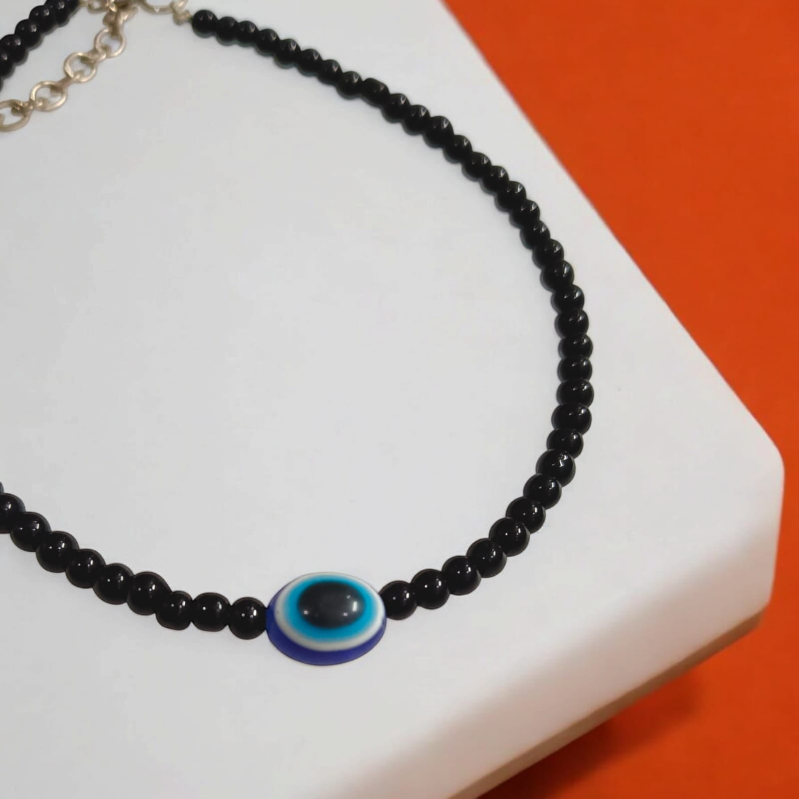 Elegant anklet pair with evil eye charm and black beads, designed for women and girls.