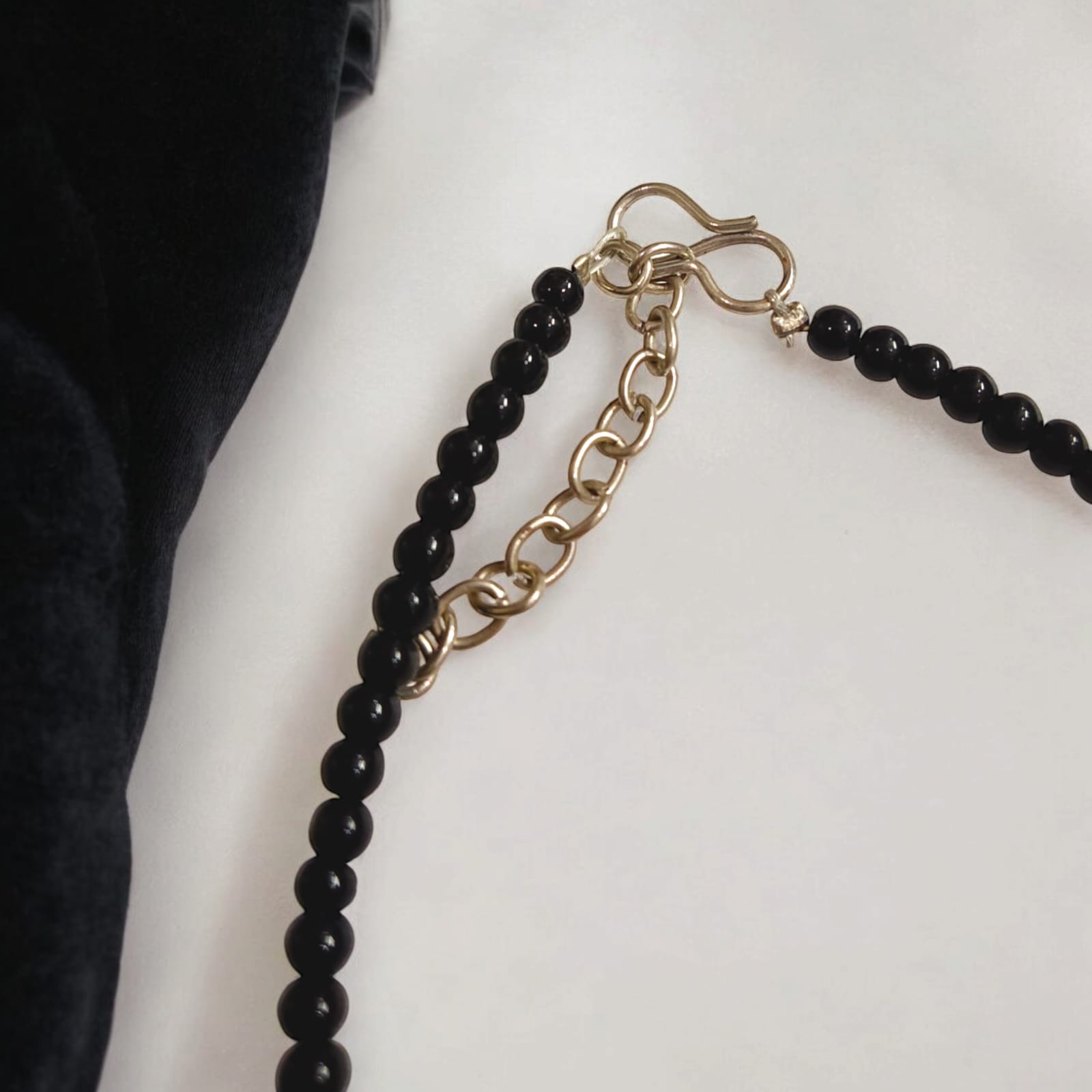 Elegant anklet pair with evil eye charm and black beads, designed for women and girls.