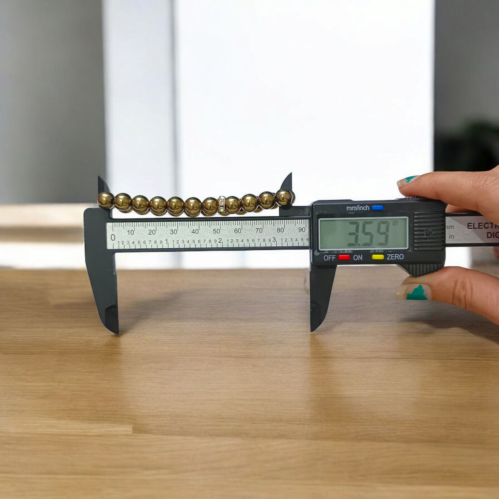 Golden Pyrite Bracelet with 8mm beads, lab-certified, displayed in a circular arrangement with elegant packaging