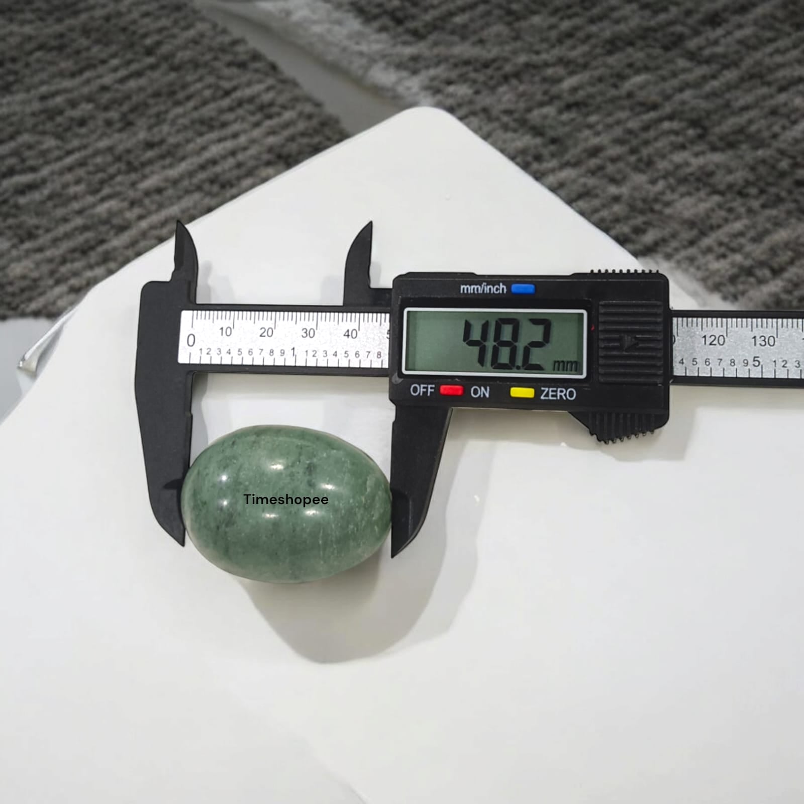 Greenish Black Shivling Stone for Tulsi and temple use, symbolizing stability and divine energy with unique natural patterns.