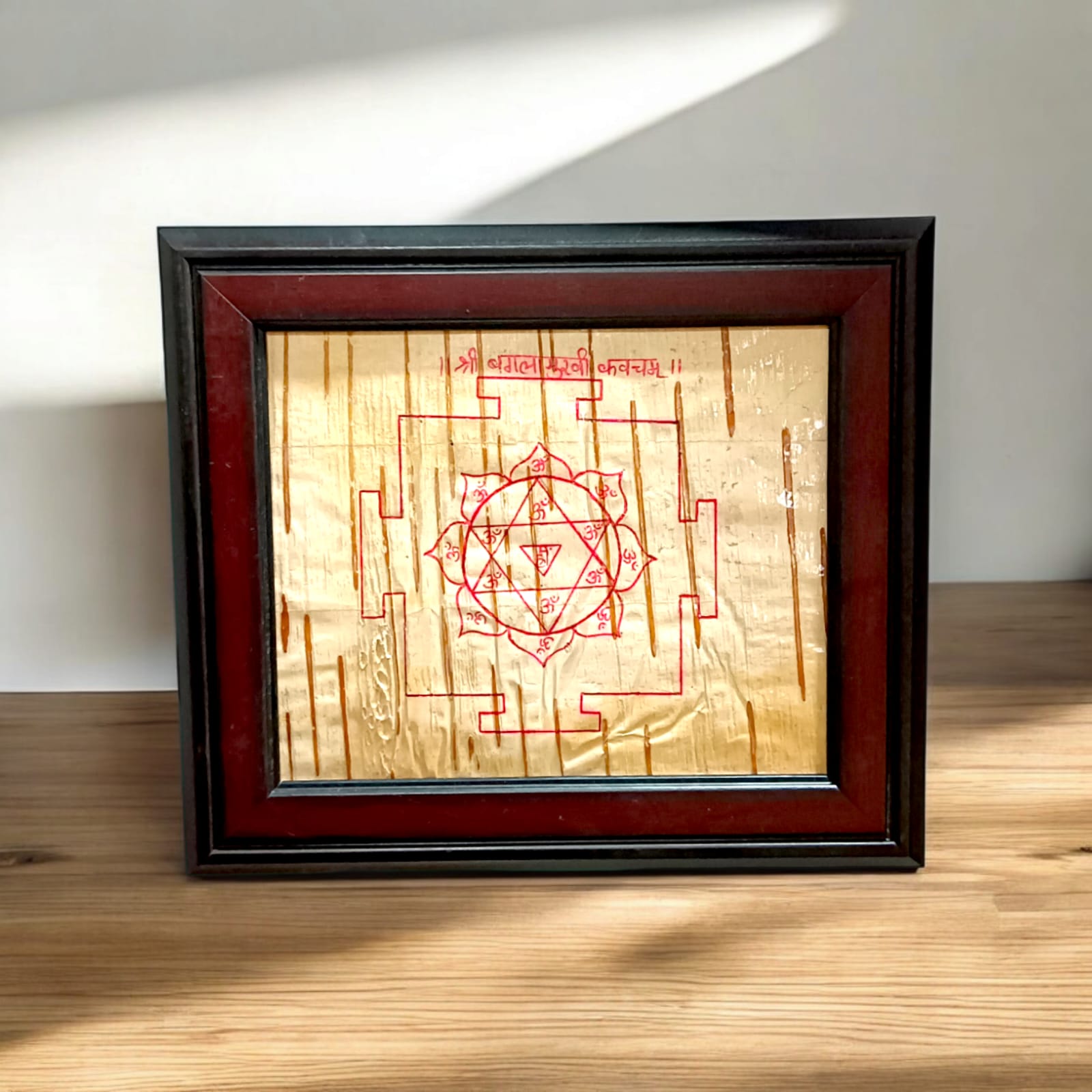 Handmade Baglamukhi Kawach on Bhojpatra with a wooden frame, 17x19 cm, for home and office temples.