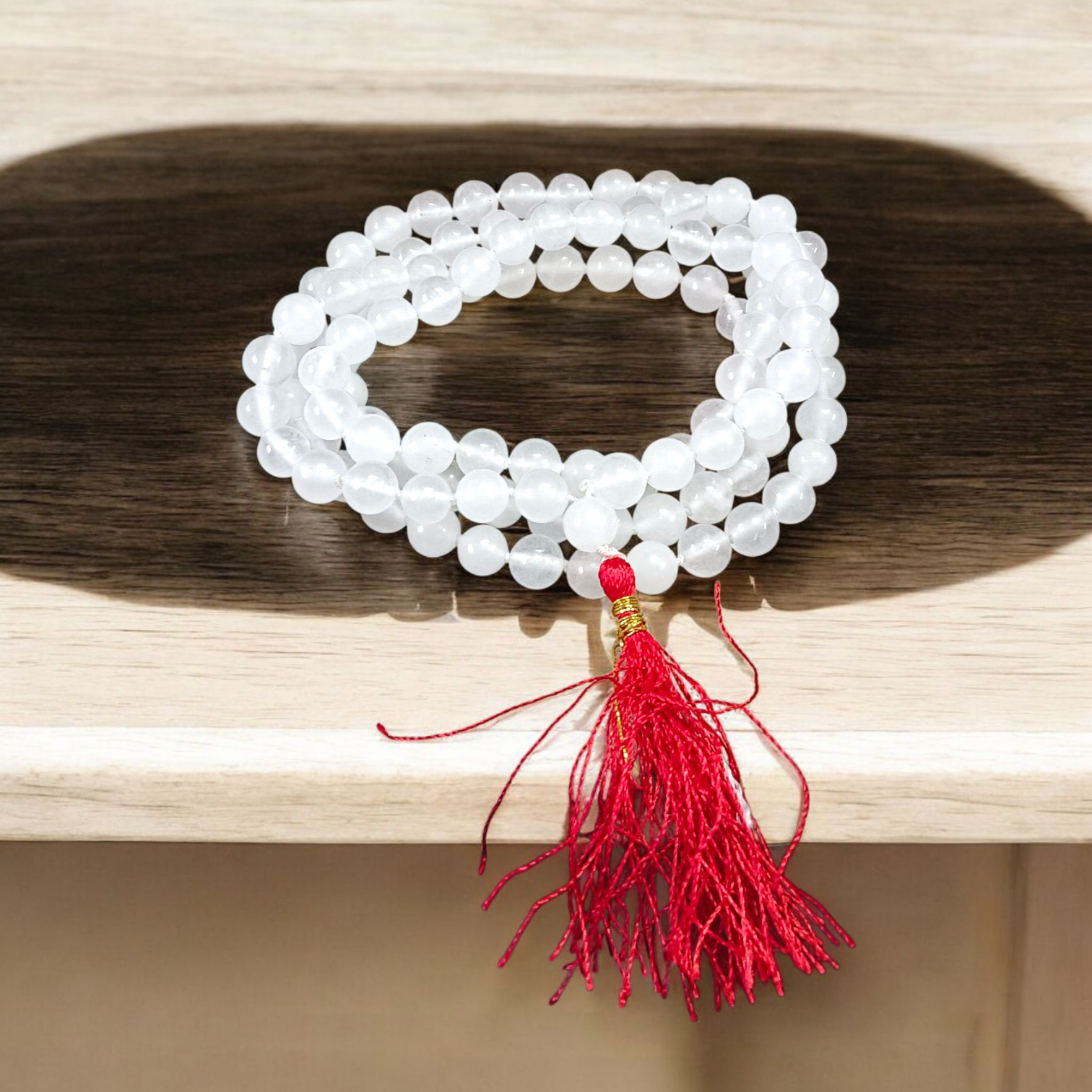High-quality Crystal (Sphatik) Mala with 108+1 transparent 8MM beads, ideal for meditation and spiritual healing, displayed on a white background