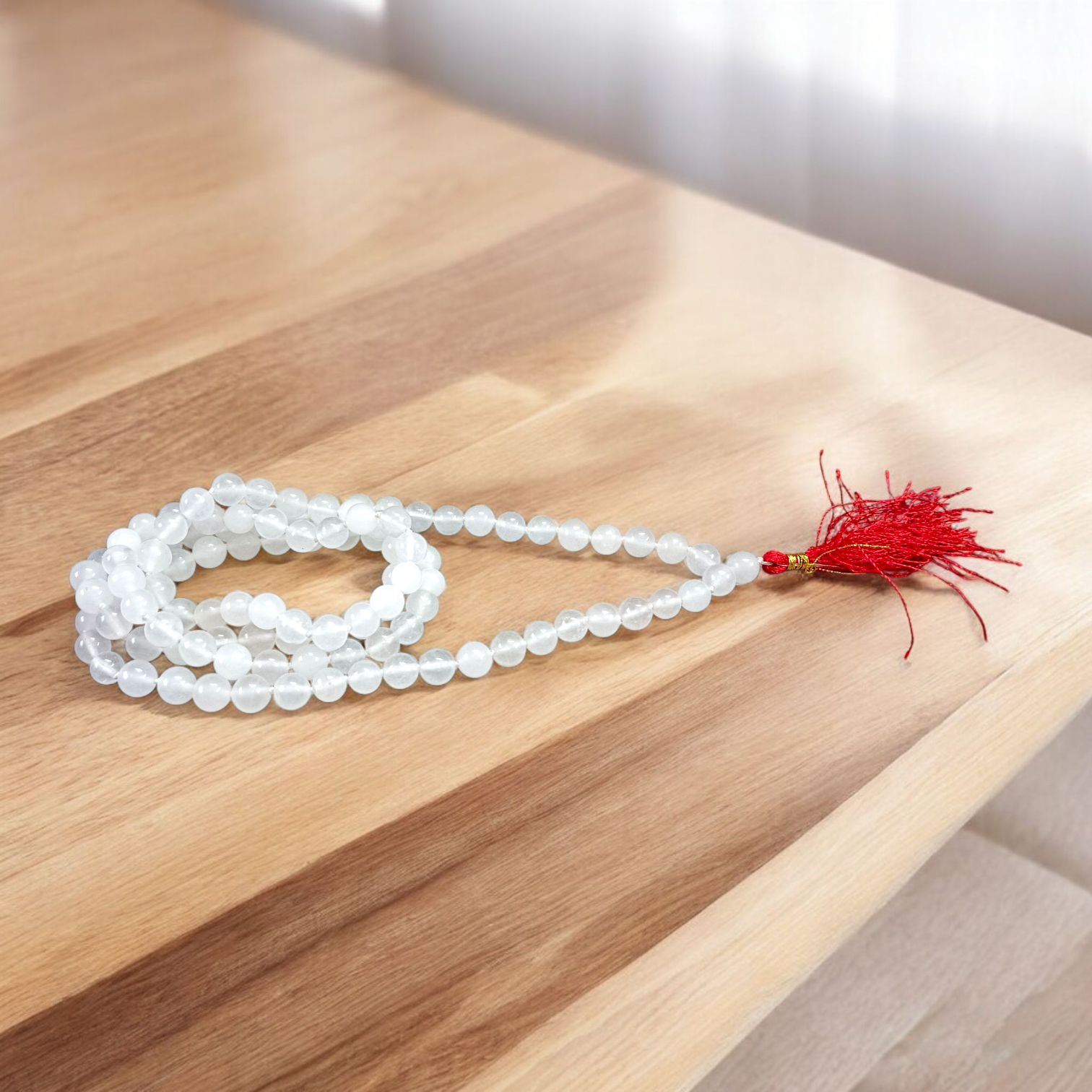 High-quality Crystal (Sphatik) Mala with 108+1 transparent 8MM beads, ideal for meditation and spiritual healing, displayed on a white background