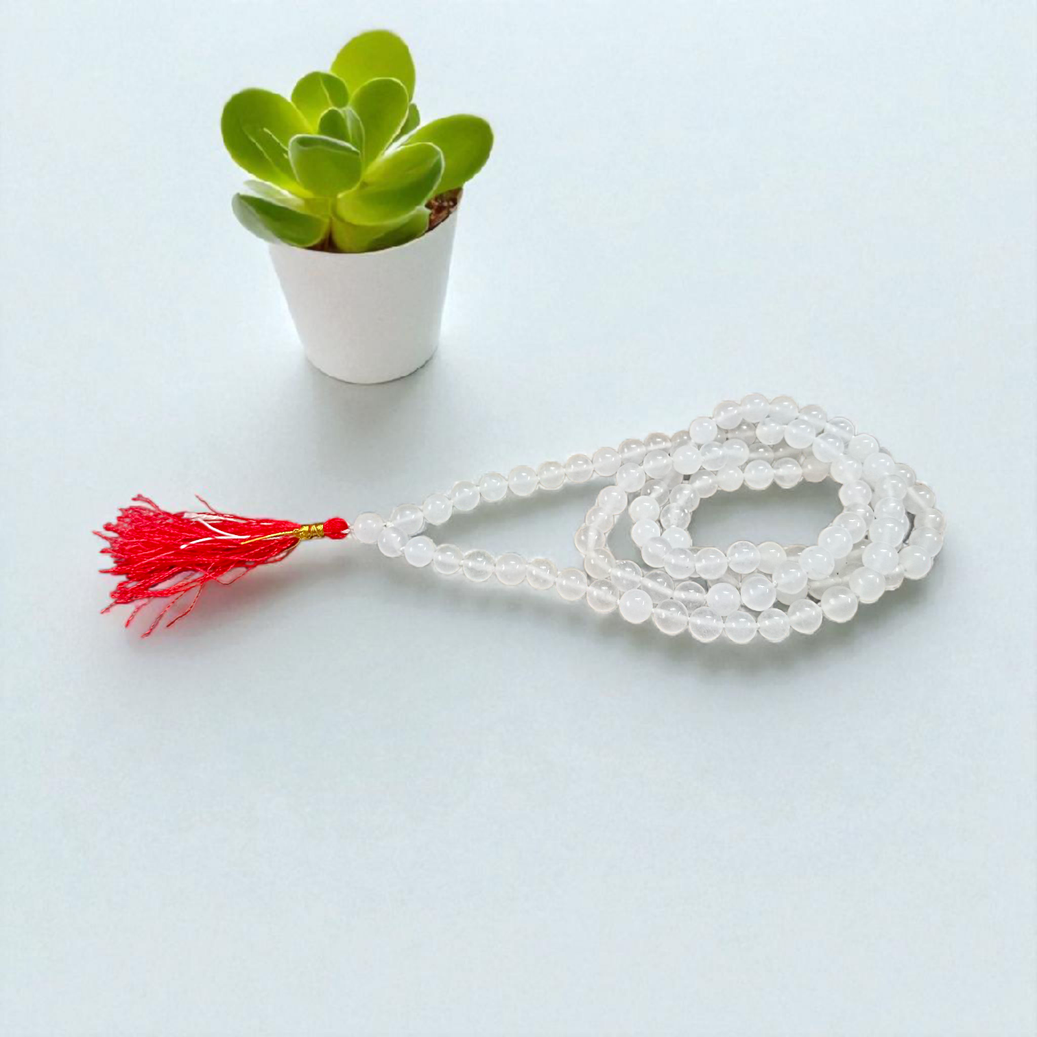 High-quality Crystal (Sphatik) Mala with 108+1 transparent 8MM beads, ideal for meditation and spiritual healing, displayed on a white background