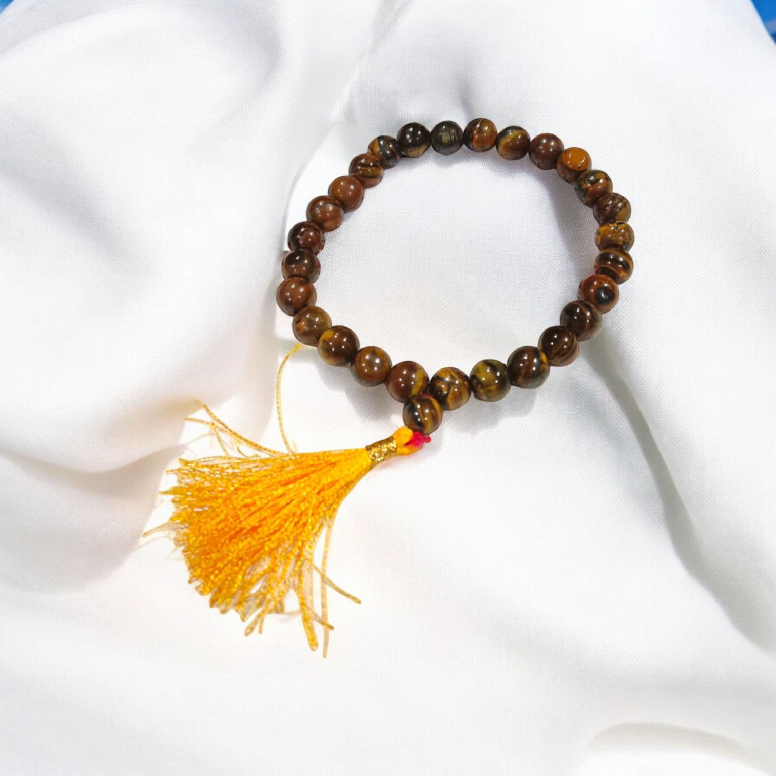 High-quality image of Tiger Eye Mala with natural golden-brown stone beads arranged in a traditional mala style